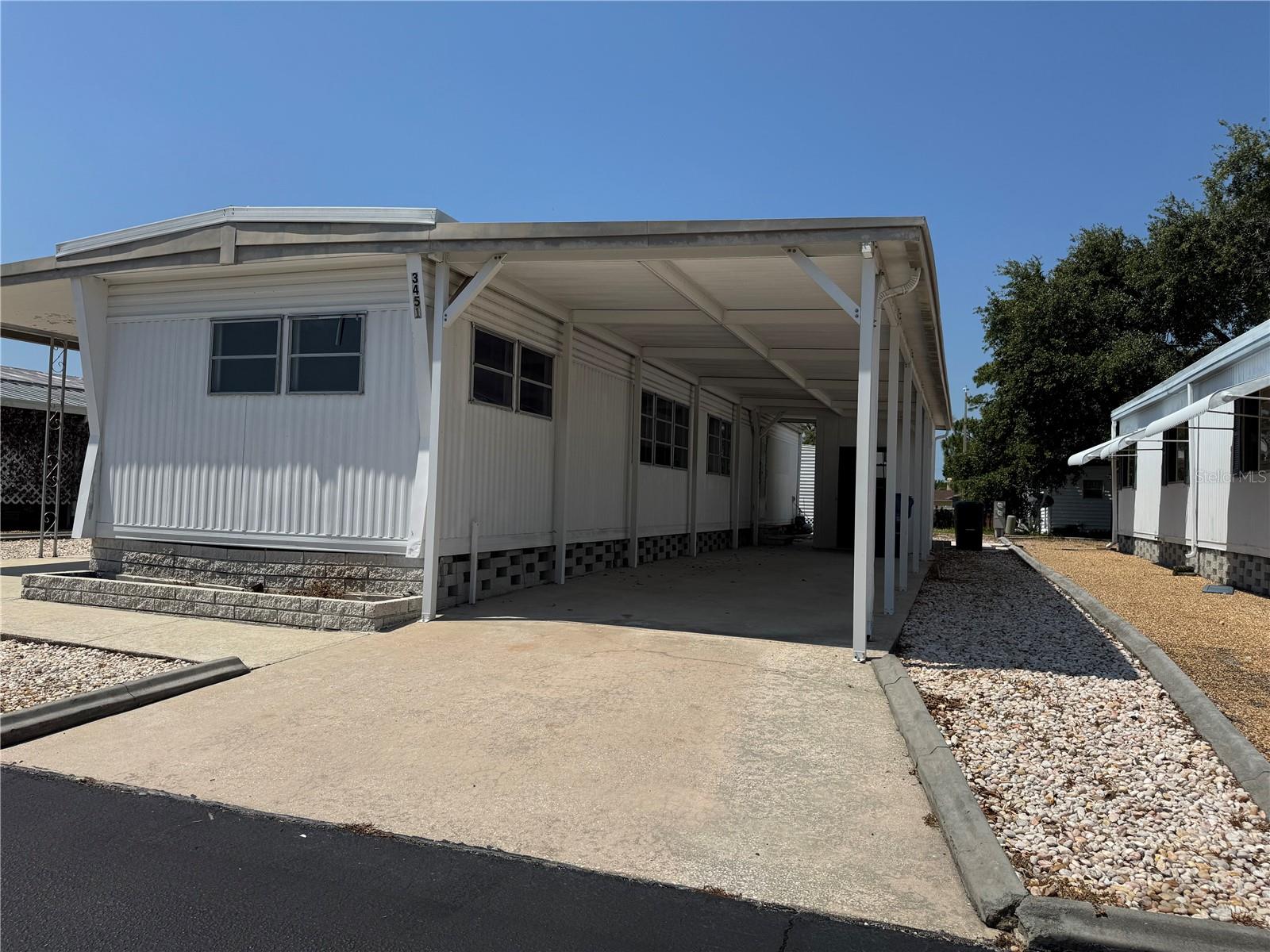 55+ COMMUNITY. Modern 2-Bedroom Home for Lease in Tiki Village Mobile Home ParK in Holiday, FL.
Welcome to Tiki Village Mobile Home Park, a gated 55+ community that offers security, comfort, and a welcoming atmosphere! This fully rehabbed home is designed with modern style and convenience, featuring 2 bedrooms and 2 full bathrooms—including one with a full-size tub for relaxation.
Enjoy high-end finishes like brand-new stainless-steel appliances, granite countertops, and a sleek tankless water heater. The split-plan layout includes two ensuites, ensuring privacy and functionality. Durable vinyl plank flooring adds sophistication, while the car park and separate storage shed with washer and dryer hookups provide ultimate convenience.
Community perks include shuffleboard, a spacious picnic pavilion, and a beautiful Veterans Memorial display at the entrance, offering a warm welcome home. No pets allowed, income requirement needed. All applicants must be approved through the HOA.