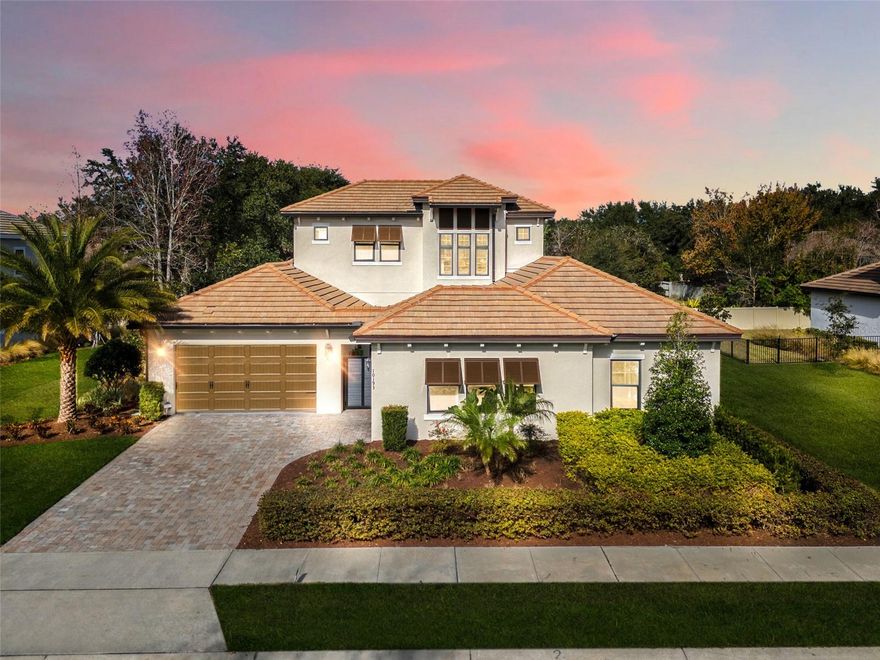 Welcome to a home that offers luxury and refined lifestyle. Located in the gated Fire Creek community near Windermere and the Butler Chain of Lakes, this 2022 former builder’s model presents a rare opportunity to enjoy comfort, beauty, and sophistication. Never lived in and professionally designed, this residence is ideal for families who value privacy, quality, and thoughtful craftsmanship. 

A private courtyard entry welcomes you into a sun-filled sanctuary featuring engineered hardwood floors, designer furnishings, and extensive luxury upgrades throughout, worth $646,000. The open concept living spaces flow effortlessly into the chef’s kitchen, complete with GE Monogram appliances and a full butler’s pantry perfect for entertaining and everyday living alike. The primary suite serves as a serene retreat with a spa-inspired bath and an oversized walk-in closet. Additional bedrooms and an upstairs bonus suite provide exceptional flexibility for multigenerational living, guests, or work-from-home needs. Step outside to a resort-style outdoor oasis featuring a custom pool, summer kitchen, and covered lanai ideal for relaxing or hosting unforgettable gatherings. 

Beyond the home, residents enjoy an active, outdoor-focused lifestyle. The renowned Butler Chain of Lakes offers endless recreational opportunities. Nearby championship golf courses provide exceptional options for golfers of all levels, while parks, trails, and lakeside amenities enhance the area’s natural appeal. Conveniently located just minutes from downtown Windermere, residents enjoy access to charming boutiques, local shops, weekly farmers markets, and vibrant community events. 

The home is also ideally positioned near major highways, premium healthcare facilities, and all the amenities that make this area one of the most desirable places to live in Central Florida. Zoned for top-rated schools, Fire Creek is a gated community where homes are thoughtfully spaced approximately 40 feet apart, offering enhanced privacy and a peaceful residential atmosphere.

This exceptional residence embodies elegance, privacy, and elevated living for those who appreciate inspired design, outdoor recreation, and an unmatched Florida lifestyle.

Important Note: Buyer has option to purchase this lovely home fully furnished. Attractive seller -financing option also available to qualified buyers.