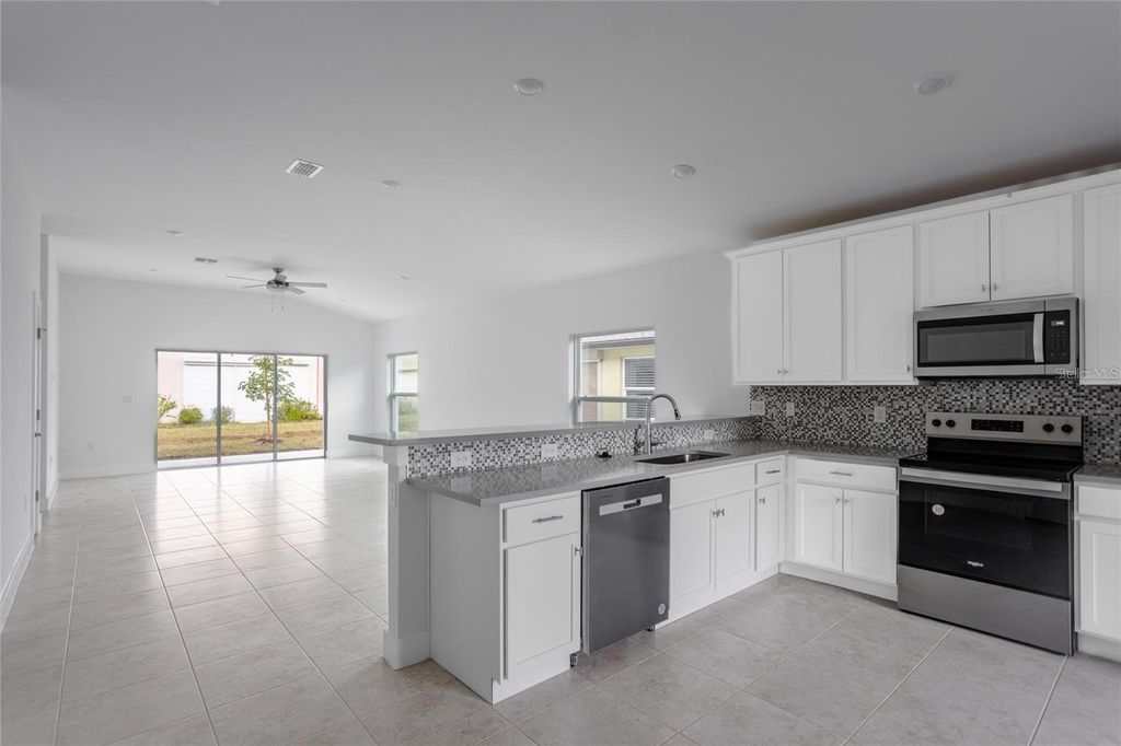 Photo of 573 Rose Apple Circle, Port Charlotte, FL 33954 (MLS # TB8429414)