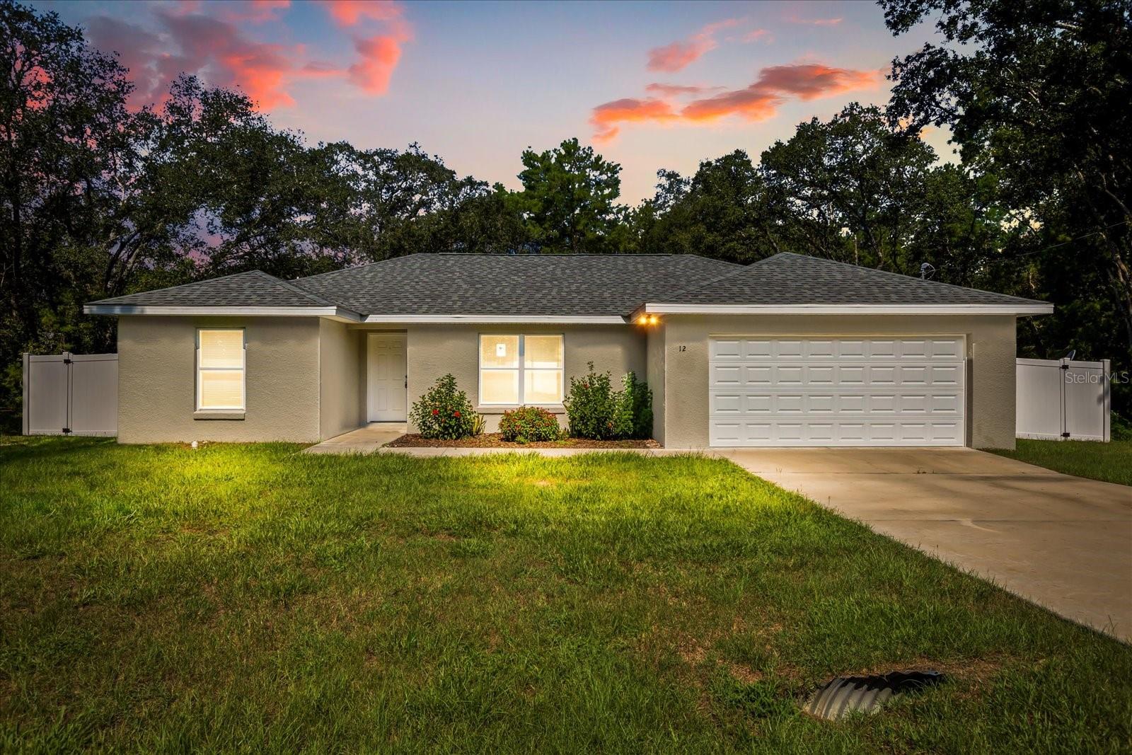 This recently built 2023 home in the desirable Silver Springs Shores community offers 3 bedrooms, 2 bathrooms, and a spacious, fully fenced backyard. The home boasts a split-bedroom floor plan with an open concept living room, dining area, and kitchen equipped granite countertops and stainless steel appliances. The spacious primary bedroom includes an additional space that can be used as an office, nursery, or sitting area, a walk-in closet, and an en suite bathroom with a tiled shower. The remaining bedrooms share a guest bathroom with a bathtub. Upgrades throughout the home include vaulted ceilings, luxury vinyl plank flooring for easy maintenance, granite countertops in both bathrooms, and a laundry area with washer/dryer hookup. Located just minutes away from Lake Weir and The Villages with convenient access to I-75, US-441, 301, and HWY 25. NO HOA! Don’t miss out on this opportunity to make this home yours! Submit your offer today!