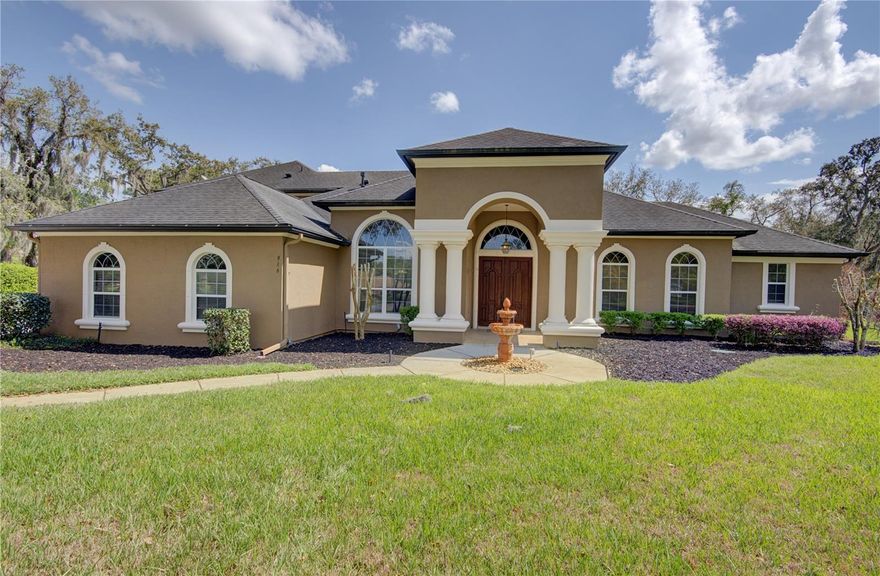 5-bedroom, 4-bath pool home on over an acre in the gated community of Estates on Lake Mills! Situated on a quiet cul-de-sac with conservation views, this exceptional residence offers privacy, space, and a thoughtfully designed 3-way split floor plan that captures the feel of private estate-style living, ideal for both family living and entertaining. The formal living and dining areas open seamlessly to the lanai through roll-away sliding glass doors, creating the perfect indoor-outdoor entertaining experience. A private office/den provides an ideal work-from-home retreat, while the gourmet kitchen features custom wood cabinetry, granite counters, a large island with breakfast bar, walk-in pantry, and a casual dining area that flows into the spacious family room. The luxurious primary suite includes a sitting area, large walk-in closet, French doors to the lanai, and a spa-inspired bath with dual vanities, jetted tub, and walk-in shower. Three large secondary bedrooms are privately separated from the main living area by pocket doors. Upstairs you will find a bedroom and bath along with a media room and bonus room. Step outside to your private outdoor oasis featuring a sparkling resort-style pool and spa plus a fully equipped summer kitchen with grill, refrigerator, and ample counter space—perfect for year-round entertaining. Additional highlights include a spacious 3-car garage, private pathway access to a neighboring gated community, top-rated Oviedo schools, close proximity to UCF and major employers, convenient access to Downtown Orlando, offering the perfect blend of privacy, luxury, and convenience.