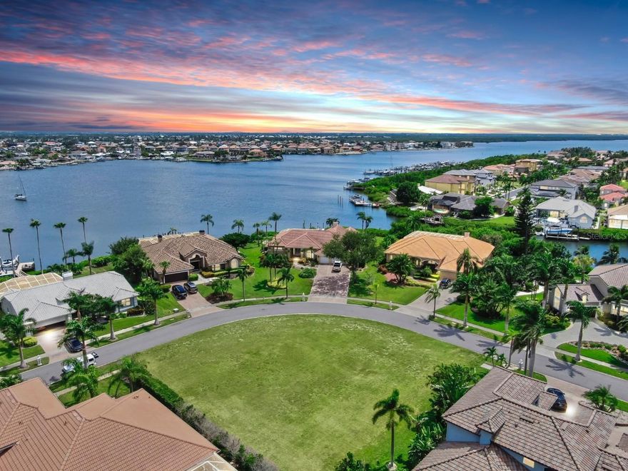 Wishing for an expansive one story home? Seeking a large 2 story with waterfront views? This oversized corner lot measures in at over 100ft x 140ft with sweeping views. Located behind the guard gates of Andalucia, a premier Tampa Bay community known for its beautiful Bayfront, you will find a Community Marina and 24/7 secured privacy, with NO CDD. Here you are welcome to create spacious main floor living plus a 3 car garage with room to spare. WE HAVE CUSTOM BUILDING PLANS! 
Not into taking on the design task, time required and expenses to design a home from scratch? That's okay! Choose from a 3,000sq ft floorplan up to an expansive one story 4,600 hrs sq ft home, with circular driveway! Need a reputable builder? We've got that lined up also! Otherwise, choose your own contractors.
Andalucia offers both on and off water lifestyles with a Community Marina located in Bal Harbor with potential to lease a deep water boat slip from the HOA. Sports courts and a Bayfront Clubhouse with Pool 
offer a waterfront location for many event memories to come. Walk, boat or bike to waterfront restaurants Circles and Finns, enjoy coffee with NY bagels, Ice cream, and Apollo Pizza sports bar which are all right outside the community gates. The Apollo Beach nature park and watch tower sit opposite end of Surfside Blvd and boardwalks lead you to the Manatee Viewing Center during season. Tampa International is just 25 miles drivetime and major Cruise lines disembark daily just 12mi from your future homesite! US Highway 41 offers quick trips to Anna Maria Island, the Skyway Bridge to Downtown St Pete and Pinellas Beaches or head North to Downtown Tampa. Disney, Busch Gardens and several waterparks never disappoint.
Your new construction home in Andalucia, Apollo Beach, FL is central in truly living Florida at its best!

Realtor Remarks: Thank you for touring! Please use showingtime. When the access request comes in I will use the name on the showing time app to give to the front gate of Andalucia. Just in case please have a copy of your real estate license, and your driver's license! We have full sets of building plans ready for review for serious buyers!