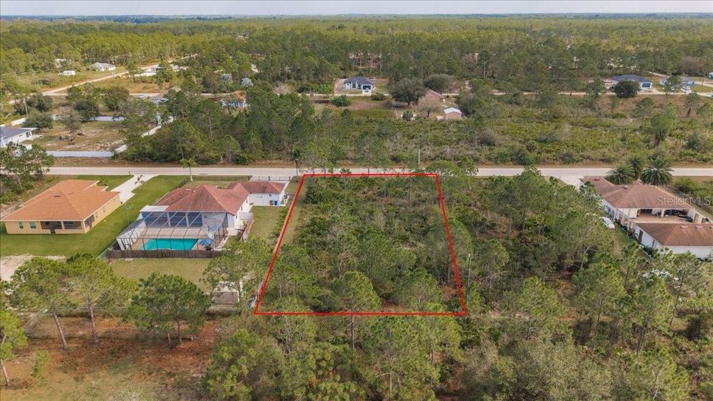 Photo of 1413 Richmond Avenue N, Lehigh Acres, FL 33972 (MLS # C7519293)