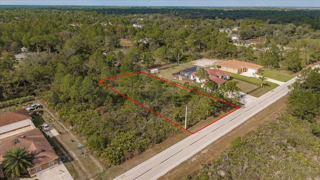 Photo of 1413 Richmond Avenue N, Lehigh Acres, FL 33972 (MLS # C7519293)