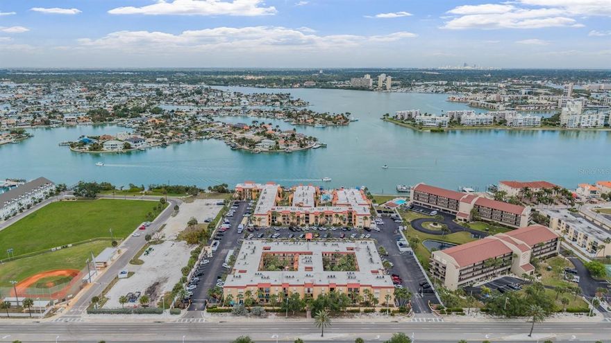 Attention beach lovers & boaters! Experience the vibrant coastal lifestyle you’ve been dreaming of in the sought-after Boca Shores waterfront community. This beautifully renovated 2-bedroom, 1.5-bath condo offers a blend of comfort, style, and convenience, just a short stroll or bike ride to the white sandy Gulf beaches. Positioned as one of the most compelling price points in Boca Shores, this is a rare opportunity to secure exceptional value—whether for personal enjoyment, investment, or both.

Enjoy the ease of a private ground-floor entrance with no stairs, making daily living and beach trips effortless. Inside, the home offers a bright, airy feel with luxury vinyl plank flooring and large windows that fill the space with natural light while maintaining privacy. Recent upgrades include brand-new stainless-steel appliances, quartz counters, upgraded bathrooms, fresh interior paint, a new AC system, and updated electrical.

The layout features a comfortable living area and separate dining space, ideal for relaxing or entertaining. The kitchen opens to the dining area through a pass-through window and features white shaker cabinets, a tile backsplash, ample storage, and a closet pantry.

The spacious primary bedroom includes sliding glass doors to a semi-private outdoor space, a walk-in closet, and an updated en-suite half bath. The guest bedroom offers two built-in closets and abundant natural light from a floor-to-ceiling window. A full bathroom with a tub and shower combo completes the interior.

Boca Shores is a gated, pet-friendly waterfront community along the Intracoastal waters of Boca Ciega Bay, featuring lush grounds and charming courtyard gardens. Amenities include a heated waterfront pool and sun deck, fishing dock with cleaning station, kayak and bicycle storage, clubhouse with seasonal activities, fitness area, grilling and picnic areas.

Additional conveniences include on-site laundry facilities and a car wash station. Boat slips are available on a first-come, first-served basis at a reasonable monthly rate, including water and electricity.  Association fee covers: Water, sewer, trash, cable, internet, exterior & ground maintenance, and more. 

Located just north of St. Pete Beach City Park—with tennis and pickleball courts, a baseball field, walking paths, and a public boat ramp—you’ll also enjoy walking distance to restaurants, beach bars, shops, and local markets, including the Sunday market on Corey Avenue and others in Treasure Island and Gulfport.

Convenient options like the beach trolley, SunRunner to downtown St. Petersburg, and Freebee make getting around easy without the worry of parking. Residents of St. Pete beach can apply for annual parking permits for the public beaches.  Downtown St. Petersburg, The Pier, and its dining, arts, and museums are just a short drive away. Tampa International and St. Pete-Clearwater airports are within approximately 30 minutes, Downtown Tampa is about 45 minutes away, and Orlando theme parks are about 90 minutes away.

Whether you're searching for a full-time residence, seasonal retreat, or income-producing property, this condo offers monthly rental opportunities and remains a longtime favorite for returning seasonal residents.  

Your beachside escape awaits! Schedule your private showing today.