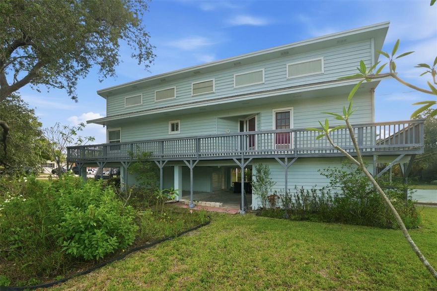 Rare opportunity in desirable Crystal Beach. Key West style home with AN ADDITIONAL BUILDABLE 50' X 118' LOT INCLUDED. Great room floor plan with island kitchen. The primary bedroom has an en-suite bathroom and a HUGH walk-in closet. There is an inside laundry room on the living level. The big ticket items are done already: IMPACT WINDOWS, TWO YEAR OLD ROOF AND NEWER A/C SYSTEM.  The home is a blank slate for your cosmetic updates and improvements.  Covered parking under the building and lots of covered and enclosed storage/workshop space on the ground floor.  This is an iconic waterfront community with lots of character and style. No deed restrictions. Just laid back living. Enjoy the community park and fishing pier on the intracoastal waterway where sunset is a daily celebration. The extra lot gives you so many options.  The entire living area of this home is elevated and has never flooded.
