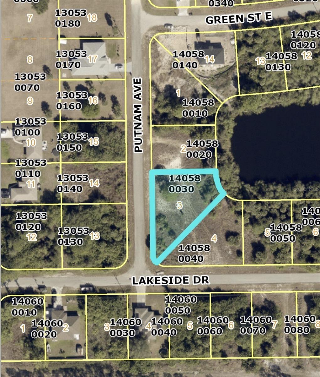 Photo of 427 Putnam Avenue, Lehigh Acres, FL 33974 (MLS # R4912196)