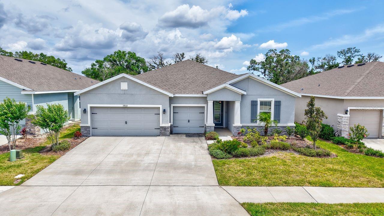 Experience luxury living in this beautifully upgraded Camden model located in the desirable community of Solera at Lakewood Ranch. Available furnished or unfurnished for an 8- or 12-month lease, this versatile 4-bedroom, 3.5-bath home with a 3-car garage offers an ideal layout for families, professionals, or multi-generational living. From the manicured landscaping and stacked stone exterior to the 8-ft ornamental glass front door, every detail has been thoughtfully designed. Inside, porcelain tile flows through the main living areas, with engineered hardwood flooring in all bedrooms—no carpet throughout.
The chef-inspired kitchen features granite counters, stainless steel appliances, custom cabinetry, mosaic tile detailing on the island, and a walk-in pantry with upgraded wood shelving. The great room is anchored by a custom shiplap accent wall and beamed tray ceiling, opening to a newly screened-in lanai with a mahogany ceiling and peaceful preserve views. Formal and casual dining areas offer flexibility for entertaining or everyday living. The owner’s suite is a serene retreat with a tray ceiling, custom feature wall, and spa-like bathroom with dual vanities, soaking tub, separate shower, and a fully built-out walk-in closet with vanity.
Two guest bedrooms share a Jack and Jill bathroom, while a private guest suite with its own living area, full bath, and bedroom offers a flexible space for visitors or in-laws. Additional upgrades include designer lighting, wainscoting, upgraded ceiling details, a spacious laundry room with cabinetry and sink, and smart home features including Deako dimmer switches and LED lighting. Solera at Lakewood Ranch offers a resort-style community pool, clubhouse, and playground, all close to shopping, dining, entertainment, I-75, and the Gulf Coast’s beautiful beaches. Rent includes lawn care, water, sewer, and trash; tenant pays for electricity and internet.
