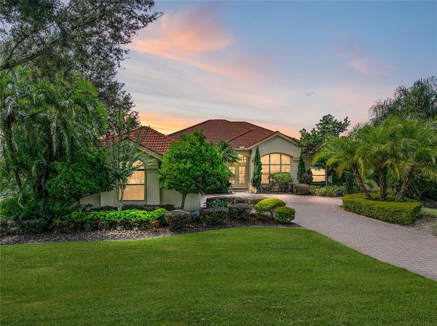 A lifestyle of luxury and leisure awaits in this fully renovated 3 bedroom, 3 bath, 3 car garage pool home, perfectly set on a corner lot just steps from Lake Jovita’s incredible amenities. A long paver drive leads to manicured landscaping and a welcoming covered entry. Inside, soaring ceilings and an open, light-filled layout create an immediate sense of elegance, while sweeping views of the pool create a feeling of tranquil Florida living. The brand-new kitchen is a showpiece, designed for daily living and entertaining. Stone countertops, custom cabinetry, new stainless steel appliances, and an eye-catching backsplash elevate the space, while the central island with multiple dining options: a breakfast bar, formal dining area, and bay-window dinette, make gatherings and everyday dining effortless. An expansive 18x21 living room brings the outdoors in with triple sliding doors that open to the screened pool deck, where covered seating, a spa, and a sparkling pool await behind the privacy of lush landscaping. A dedicated office near the entry offers the perfect retreat for work or study. The primary suite is a serene sanctuary with two walk-in closets and a fully reimagined ensuite bath featuring a dual vanity, designer lighting, and a custom glass surrounded walk-in shower with multiple showerheads. Two additional bedrooms are thoughtfully placed: one with a walk-in closet and nearby access to an updated guest bath, and the other with its own ensuite access to the full pool bath for seamless convenience. Several major upgrades add to this home’s incredible value: a whole-house generator with an owned 250 gallon propane tank, 2024 water heater, new luxury vinyl plank flooring throughout most of the home, new LED lighting, an updated kitchen and bathrooms, pool equipment, custom blinds, an outdoor electric screen, and so much more. It is set within the highly regarded Lake Jovita community that includes a 24 guarded gate and access to a playground, basketball and pickleball courts, a dog park, and walking trails. Optional membership packages to the Golf and Country Club can include access to 2 18-hole golf courses, a clubhouse with a restaurant and fitness center, a Jr. Olympic size swimming pool, tennis courts, and more! This home is the epitome of comfortable, updated, resort style living in a fantastic location. Do not miss you chance to experience it in person- call today!