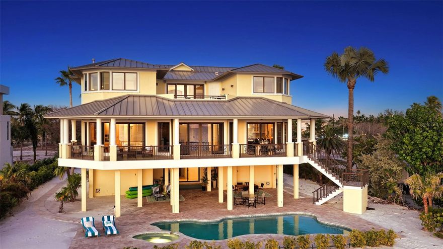 100' of direct beach and gulf frontage..... Welcome to Paradise! Experience the ultimate in Longboat Key and Gulf-front luxury with this spectacular nearly 6,000 sq. ft. beachfront estate on Longboat Key. Perfectly positioned on a pristine stretch of white-sand shoreline, this gorgeous beach home offers unobstructed, panoramic views of the Gulf of Mexico from nearly every room in the home. Also featuring over 3,000 sq. ft of under-roof outdoor relaxation and entertainment space. Designed for family gatherings and beach front fun, this is the perfect beach home for tranquil coastal living. This beach home features 6 bedrooms, 6.5 bathrooms, a den and a family room, as well as a stunning 24' x 24' rooftop sun deck. Built in 2002, this waterfront beauty offers many unique details like the Mahogany front door, elevator to all 3 levels, all new exterior paint and interior paint, and best of all three expansive levels of outdoor living space, each capturing the beauty of daily sunsets and unobstructed Gulf and beach views. At the heart of your beachfront oasis is a newly refurbished resort-style pool and new paver patio, framed by swaying palms and endless water views. Just steps beyond the pool is access to your 100' of private beach frontage leading directly to the soft sand and crystal-blue Gulf waters. The main level Owner's suite is large, with direct and unobstructed Gulf and beach views.  The kitchen is spacious and open, with top-of-the-line appliances and direct Gulf and beach views to enjoy while you cook. The guest bedroom suites are all spacious, with ensuite bathrooms and great Gulf and beach views from every bedroom. Whether you’re seeking a serene retreat or an entertainer's dream, this exceptional Longboat Key residence delivers unparalleled beauty, privacy, and a front-row seat to Florida’s most breathtaking coastline. Hurry up and get here, the views are spectacular!