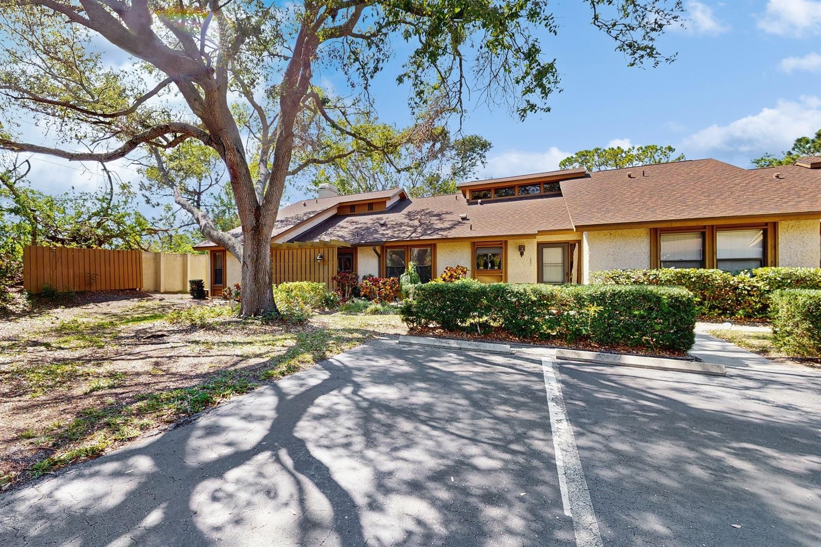 HUGE PRICE REDUCTION!!! Charming 3 Bedroom Villa in Northwest Bradenton's Pine Bay Forest. Welcome to this beautifully maintained 3 bedroom 2 bath end unit villa in the sought after Pine Bay Forest Community. With 1485 square feet of open living space, this home offers a perfect blend of comfort and convenience. Step inside to a spacious open floor plan featuring a dining and living room combo with vaulted wood ceilings and a cozy wood-burning fireplace. The glassed-in lanai adds extra space to relax and enjoy the lush mature landscaping. Tile floors throughout provide a stylish and low-maintenance touch. The primary suite boasts two walk-in closets and an en-suite bath with a soaking tub, offering a peaceful retreat. A covered carport and additional storage room provide practicality and extra storage space. Located in a vibrant community on the shores of Palma Sola Bay, residents enjoy access to a pool, spa, sauna, tennis and pickleball courts, and a deck perfect for watching the sunset. Just a short bike ride to Robinson Preserve, Desoto Memorial, and Botanical Gardens, and less than 5 miles from the stunning beaches of Anna Maria Island. Conveniently close to Publix, Target, dining, shopping, IMG Academy, and major airports, with easy access to Downtown Bradenton and Sarasota. This turnkey furnished villa is ready for you to move in and start enjoying the Florida lifestyle! Don't miss this opportunity--schedule your private tour today!