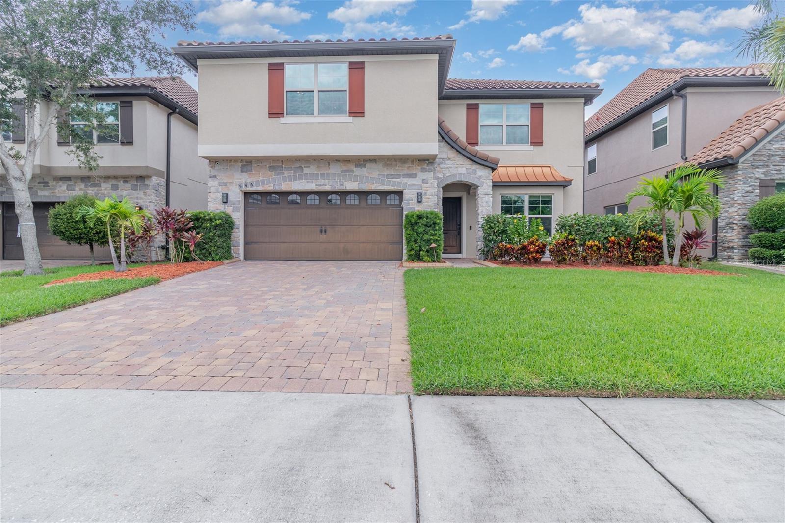 Stunning 5 bedroom, 4 bath home in the highly sought after Johns Lake Pointe community offering over 3,100 sq. ft. of living space. This spacious residence features luxury vinyl plank flooring, stone countertops throughout, and an open-concept layout designed for modern living. The gourmet kitchen is equipped with a large island, stainless steel appliances, ample cabinetry, and plenty of storage. The second floor includes a versatile loft, laundry room, and a spacious owner’s suite with walk-in closet and spa-like bath complete with dual vanities, soaking tub, and separate shower. Additional bedrooms provide comfort and flexibility for family, guests, or office space. Enjoy Florida living with a screened lanai, fenced backyard, and a durable tile roof. Johns Lake Pointe offers resort style amenities including a community pool, clubhouse, fitness center, and tennis courts, with convenient access to shopping, dining, major highways, and top-rated schools.