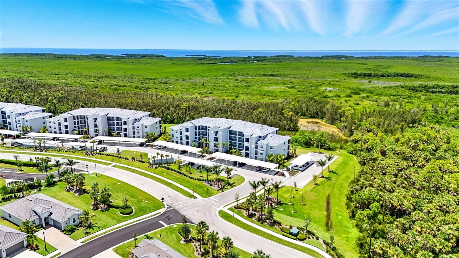 TOP FLOOR Birkdale floorplan with spectacular water and nature preserve views by day and breathtaking sunset views in the evening. This like-new luxury condo in Heritage Landing Golf & Country Club in Punta Gorda Florida is less than one year old, barely lived in, and is being sold furnished to make your move seamless. A screened entry has been added to enhance the breezes flowing through the home from the harbor. The open concept layout connects the kitchen, dining, and living areas, creating the perfect space for entertaining or relaxing. The living room features a lighted ceiling fan and blackout roller shade on the sliding doors leading to the lanai. The kitchen offers abundant cabinetry, quartz countertops, and stainless steel appliances. The dining room has an expanded view with the three window bay that not all Birkdales enjoy. The primary suite comfortably fits a king-size bed and includes a walk-in closet, lighted ceiling fan, and ensuite bath with quartz counters, a linen closet, and a fully tiled shower. The guest bedroom fits a queen-size bed, has a double closet, and is conveniently located next to the second bathroom with quartz counters and a tub/shower combo. A dedicated laundry area with full-size washer and dryer is located inside the unit for added convenience. The lanai will quickly become your favorite spot with expansive views stretching all the way to Charlotte Harbor and even Sunseeker Resort. An exterior storage closet with shelving and a bike hook, plus a covered parking space, add extra functionality. Heritage Landing Golf & Country Club offers a true maintenance-free Florida lifestyle with amenities including a 24/7 fitness center, spa, sauna, resort-style pool with beach entry and lap lanes, multiple satellite pools, tennis, pickleball, bocce, a poolside tiki bar, and fine dining at the clubhouse. A full-time activities director ensures there is always something to enjoy with weekly events and live music. Punta Gorda is a hidden gem on Florida’s Gulf Coast, known for world-class boating and fishing, boutique shopping, and chef-owned restaurants. The area’s best beaches are only 45 minutes away and two airports make travel simple. Condo fees include water, sewer, trash, and exterior pest control, making this truly maintenance-free living. Start enjoying paradise today! Be sure to view the video and 3D tour for more details.