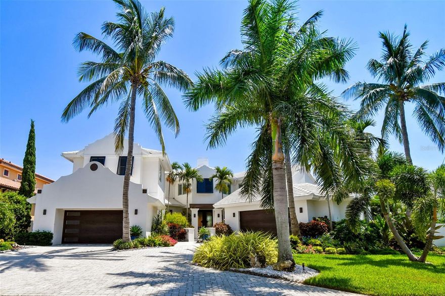 Waterfront Luxury Smart Home in Bayway Isles, conveys fully furnished. Effectively new construction due to the massive improvements of the seller (2021-2023), this home boasts of 6 bedrooms including an ample primary suite, 7 1/2 bathrooms, 3 fireplaces, 2 offices/dens, 2 boat & 2 jet ski lifts, propulsion pool for swimming, gym, expansive deck and balconies, 2 deep garages with charging station and even comes with its private beach. 100 feet of water frontage w/ kayak launch.  Home is fully automated with Control 4.  New custom furniture, rugs, lighting and decor (entirety of 1st floor and outdoors).  Gated community. Meticulously landscaped and maintained, this home is a true tropical paradise. Virtual walkthrough available upon request.