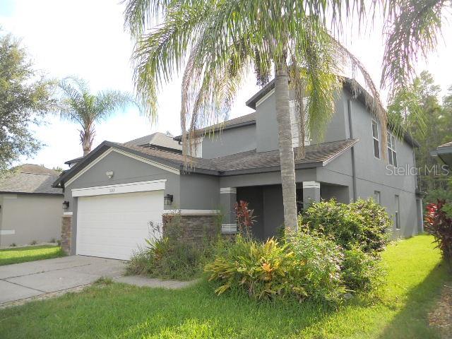 Concord Station is a much desired community for the active lifestyle families in Land O Lakes, Florida. The Master Suite with Modern Private Bath is on the First Floor. The stair to the second floor opens to the Loft surrounded by the other bedrooms. This Home has a Covered Back Porch and a Huge Back Yard perfect for the BBQ and slip n slide. Enjoy the Open Spaces and Community Places or Retreat to your Private Oasis. The Resort Style Amenities include a Clubhouse, Beach Volleyball, Tennis Courts, Basketball Courts, Community Pool, Scenic Trails for Biking or Walking. Centrally Located with easy access to the Veterans Expressway, Tampa Airport, Downtown, Beaches and Boat Ramps you are never too far from the action. Make this place your Special Living Space.