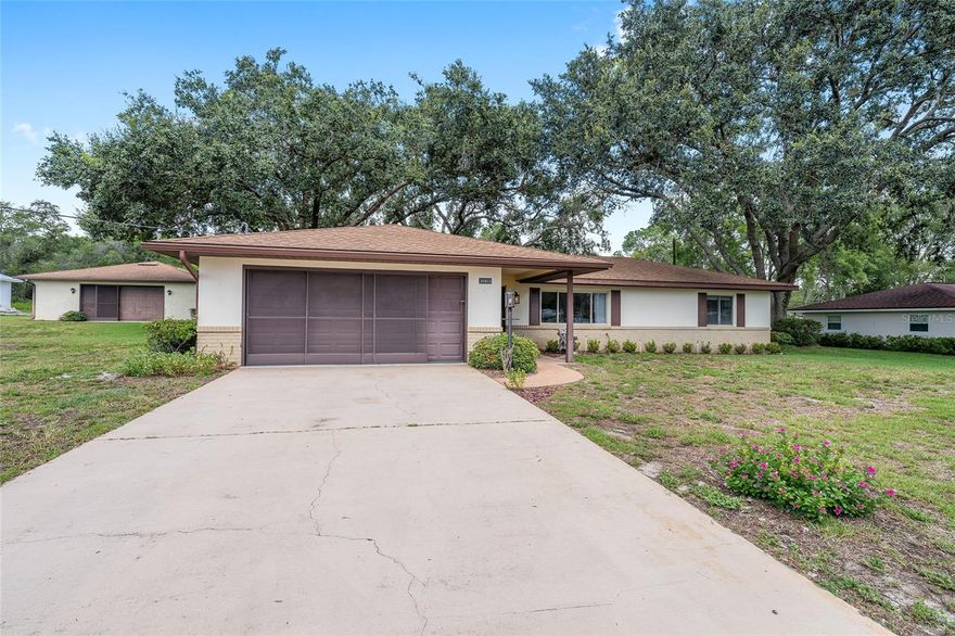 Fisherman's Paradise - Conveniently located just off Lake Griffin in Fruitland Park, this home has been remodeled and comes TURNKEY.  There is a 30 x 40 (approx) DETACHED garage on the property providing great storage for boats and cars or entertainment with a sink, workshop area and 4 skylights.  The home itself has been remodeled with newer windows and a sliding door off the Family Room in 2010.  Current owner put in all NEW ELECTRICAL in 2022 and a NEW WELL in 2025.  This 3 Bedroom / 2 Bathroom home comes furnished (all KING-sized beds in bedrooms) and is smartly decorated.  Both bathrooms have walk in showers.  The Primary Bedroom has a walk-in closet.  The Laundry is located in the attached 2-car garage, which also has an extra refrigerator and tons of storage.  Golf Cart is available separately.  All this sits on 3/4 of an acre and is available immediately.  Happy Fishing!   *Seller is offering a 1 year Broward Factory Service Home Warranty.