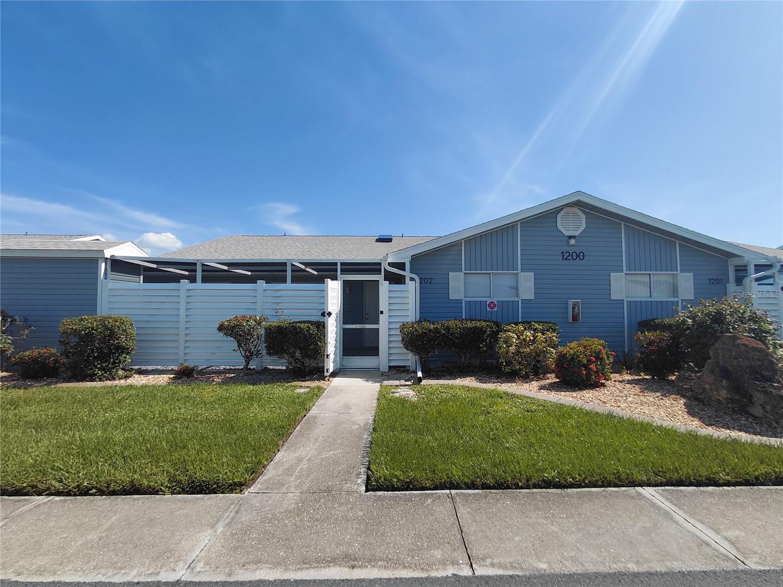 Gorgeous corner unit steps to the pool. Luxury vinyl plank floors, ceiling fans in all the rooms, granite counters, stainless appliances, bright open floor plan with a skulight, walk in closets in both bedrooms. Plenty of closet space. All rooms open out to the large screened in lanai. Small shed for additional storage. 2 assigned parking spots right out front. Community features 2 pools and a lake. Close to everything that Florida has to offer. Shopping, Charlotte Harbor, freeways and more.
