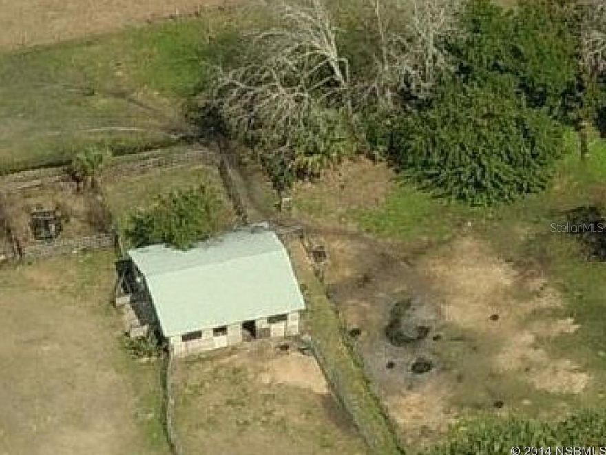 5 acres on paved road in area of uper scale homes. Property already has a six stall barn in good shape, horses allowed. Five minutes to shopping, ten minutes to beach. Fenced and crossed fenced. ;Water: Available at Site