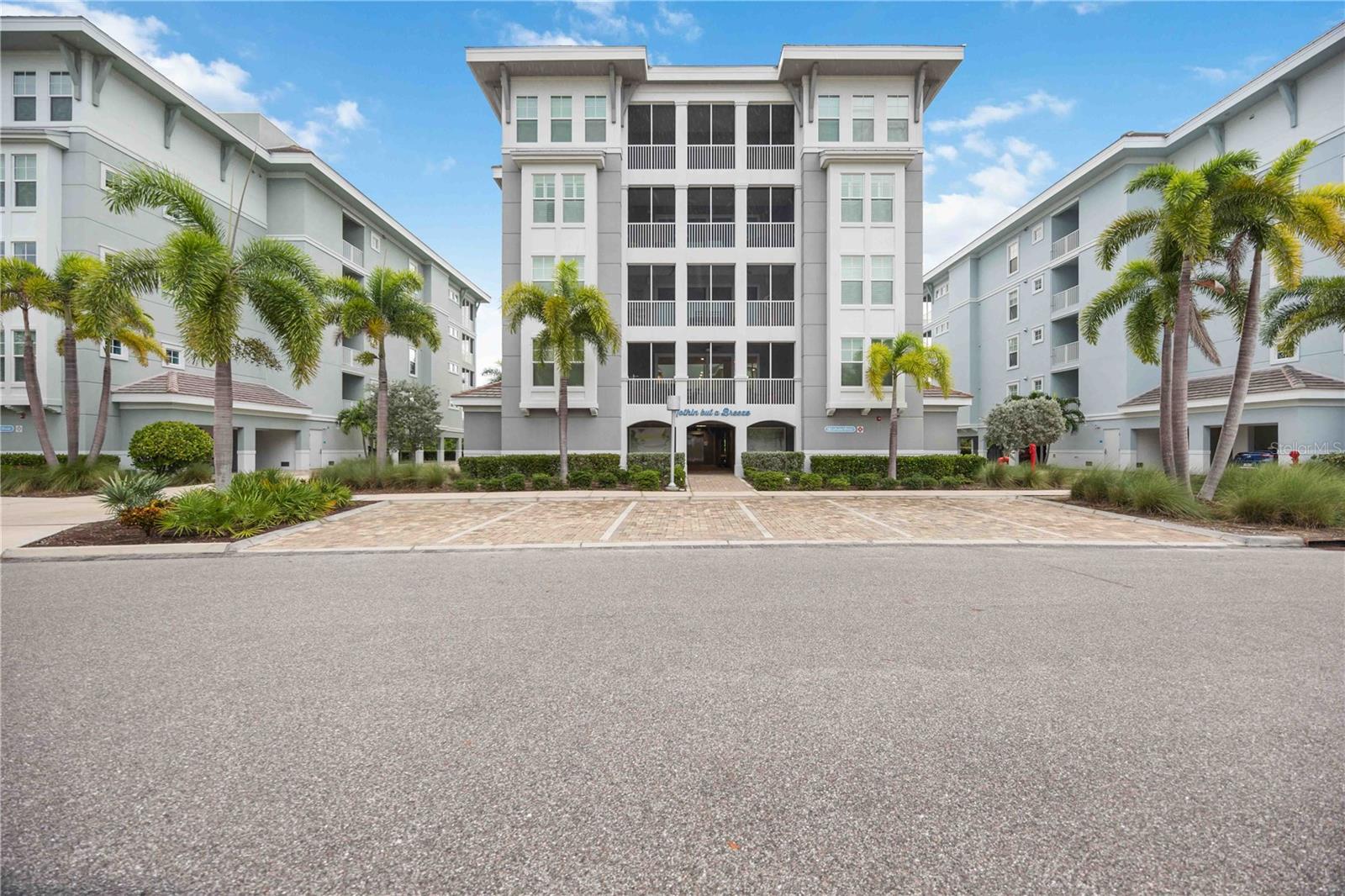 Waterfront living without the stress at One Particular Harbour, where island-style living meets luxury and convenience. This stunning 2-bedroom, 2-bathroom residence offers unparalleled sunset views and access to a deep-water marina, providing direct entry to the Gulf of Mexico. As you step inside this beautifully decorated condo, you'll be greeted by an airy, open-concept living area with exquisite tile flooring throughout. The chef’s kitchen is a true culinary haven, featuring plenty of cabinet space, stainless steel appliances, quartz countertops, a unique tile backsplash, and a massive center island. Enjoy your morning coffee at the island while soaking in the breathtaking views through the wall-to-wall sliding doors that open to a screened-in lanai, overlooking the community pool, lounge area, and a peek-a-boo view of the bay. The primary suite is a sanctuary, offering ample space for a king-sized bed, an en-suite bathroom with a luxurious walk-in shower, and an expansive walk-in closet for all of your storage needs. The second bedroom comfortably accommodates a queen-sized bed, offering a cozy retreat for guests or family members, or it could serve as a fantastic, sunny office space. An indoor laundry closet completes this fabulous home, adding to its convenience and charm. Nature enthusiasts will love the proximity to three nearby nature preserves, perfect for walking, biking, paddleboarding, and kayaking. Residents of One Particular Harbour can also indulge in resort-like amenities, including a heated pool, playground, and dining at Florida's Bar and Grill. All of this is just one mile from the pristine sandy beaches of Anna Maria Island. Experience the ultimate in relaxation and luxury at Jimmy Buffett’s Margaritaville’s One Particular Harbour. With the community's limited rental restrictions, you have the flexibility to use this property as an income-producing rental or enjoy it as your forever residence! Don’t wait, your waterfront paradise awaits!