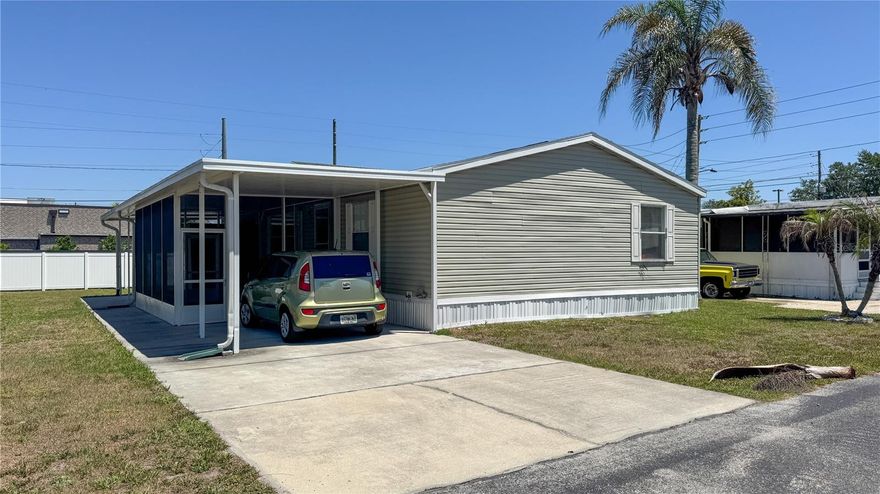 Welcome to comfortable and affordable Florida living in the desirable 55+ community of Palm Isle in Apopka! This well-maintained double-wide manufactured home is being offered fully furnished and is truly move-in ready. Featuring 3 bedrooms and 2 bathrooms, the spacious layout offers generous living and dining areas, a large kitchen with center island, abundant cabinetry, and plenty of storage throughout the home.

The primary suite includes a private bathroom and ample closet space, while the additional bedrooms provide flexibility for guests, hobbies, or a home office. This home also includes a washer and dryer space, covered carport, storage shed/workshop, and a welcoming covered porch perfect for relaxing and enjoying the Florida lifestyle year-round.

Recent updates include a newer roof and newer exterior A/C compressor for added peace of mind. Conveniently located near shopping, dining, medical facilities, and major roadways, Palm Isle offers a friendly and active community atmosphere. Whether you are looking for a seasonal getaway or full-time residence, this furnished home is ready for its next owner! Land is leased; buyer subject to community approval and age restrictions.