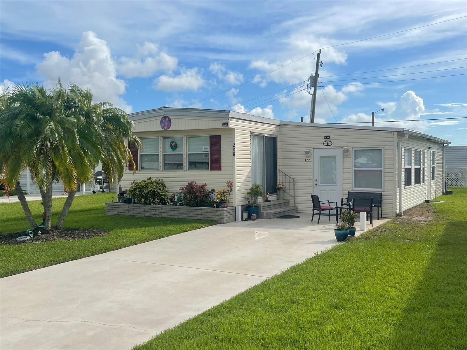 **Renovated 2BR/1BA Mobile Home in 55+ Waterfront Community – Land Owned by Seller Included!**
Step into your idyllic abode at **208 Marlette Dr, North Port, FL, 34287**, and reside in a splendidly renovated mobile home within an exclusive 55+ community. This gem provides 1054 sq.ft. that comfortably accommodates 2 bedrooms and 1 bathroom. Originally built in 1973, significant upgrades were made in 2003, and further updates followed in 2023. These include a robust new metal roof, a stylishly redone laundry room, and improved storage amenities. The home comes thoughtfully equipped with barely-used furnishings, all set for your seamless transition.
The living room radiates charm with its eye-catching tile flooring, while the luxury vinyl blanketing the rest of the home adds a refined ambiance.
Adding to the allure is that there are no additional costs for the land – it is entirely owned by the seller, ensuring a hassle-free purchase. The picturesque surroundings of a waterfront setting blend a peaceful atmosphere with the spirited lifestyle of a robust community. Only a short distance from the lively downtown Wellen Park in Venice, this location affords you a perfect balance of serene living and access to urban indulgences like shopping, dining, and entertainment.
In an act of extraordinary commitment, the seller has consented to fund the installation of a new carport, with all paperwork finalized for your convenience.
This property is proudly offered on an "as is" basis, streamlining the acquisition process. Embrace this unique opportunity to be part of a serene, 55+ waterfront community where home comfort meets the zest of downtown Wellen Park.
**Special Features:**
* Turnkey 2BR/1BA mobile home in a scenic 55+ waterfront community
* The land is owned by the seller, no additional cost to the buyer
* Recent updates including a new metal roof, modern laundry room, and increased storage
* Beautifully furnished for immediate occupancy
* Seller-funded installation of a new carport
* Offered under an "as is" contract
For more details or to schedule a tour of this tranquil retreat at 208 Marlette Dr, please get in touch. Begin your peaceful, refined living amidst the picturesque North Port, Florida.