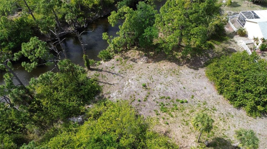 * NO HOA * NO CDD * X FLOOD on most of the lot & GREAT FISHING or KAYAKING from your own backyard! Discover the perfect haven for kayaking and boating enthusiasts with this .31-acre gem featuring a brackish water canal on cul-de-sac. No HOA restrictions and the assurance of an X flood zone for about half the lot, allowing you to envision your dream home, pool, and perhaps a spacious garage. The strategic positioning of your future home will allow breathtaking views of the canal on this oversized lot with 168 feet of waterfront. Access is a breeze where the lot is situated at the end of the cul-de-sac. The proximity to the Cape Haze Pioneer Trail, an 8.5-mile biking and walking trail managed by Charlotte County, adds to the allure. Not in a scrub jay zone according to the latest Charlotte County map. Located less than 9 miles from Boca Grande Causeway ,just about 9 miles to Englewood Beach and within 2 miles of essential amenities, including grocery stores and restaurants. Seize the opportunity to explore builders we know are ready to turn your vision into reality in the sunny paradise of SW Florida.