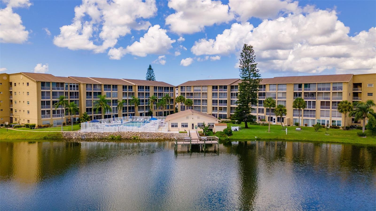 Welcome to Bayshore on the Lake a 55 plus community. This 2 bedroom, 2 bath ground level condo with laundry in the unity is ready for its new tenant. Beautiful view of lake from the lanai where you can enjoy your morning coffee. Lots of recent updates. Kitchen offer a pass through to the dining room. Primary bedroom has its own bathroom with walk in shower. The 2nd bedroom is spacious and perfect for guests or office. Enjoy the clubhouse that hosts many different activities, a heated pool, fishing pier and shuffleboard. Close to shopping, restaurants, golfing and beaches. This the one you have been waiting for to rent.