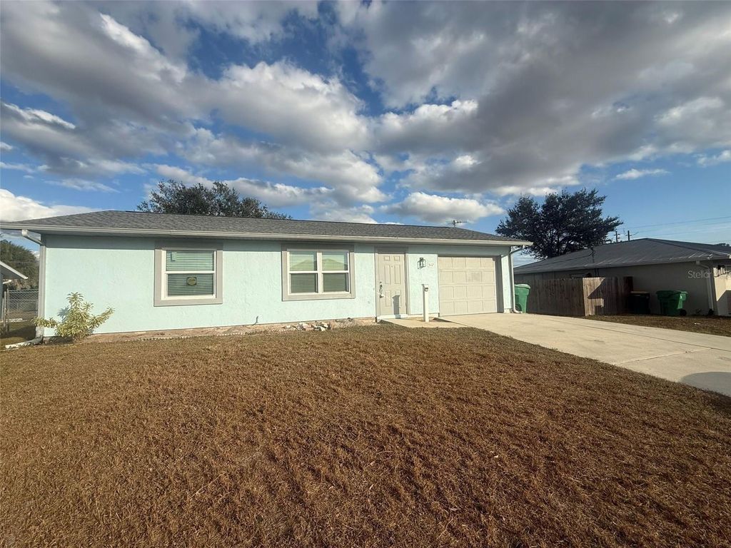 Photo of 512 Dewhurst Street, Port Charlotte, FL 33954 (MLS # C7519091)