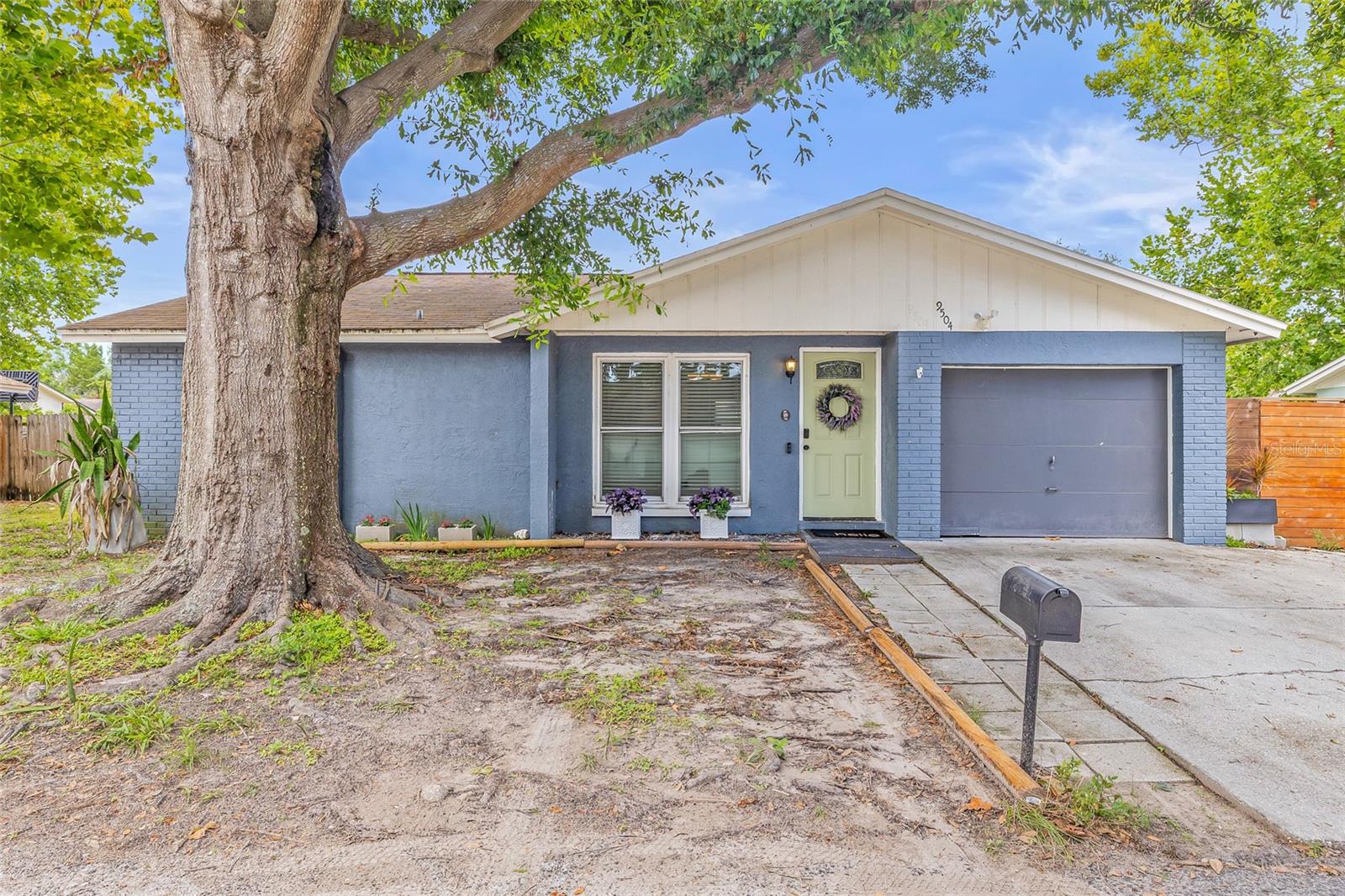 Under contract-accepting backup offers. **STOP THE CAR, HONEY – WE FOUND IT!** This beautiful 4-bedroom, 2-bathroom single-family block home in the Timberlane subdivision has been tastefully renovated. NO HOA - NO CDD - NO FLOOD ZONE. This beautiful home features wood-look tile throughout, an updated kitchen with granite counters and stainless steel appliances, and modern bathrooms with accent floor tiles. The garage has been converted to add a fourth bedroom, making it a good size for an in-law, parent, or adult child.
**UPDATES INCLUDE:** Dishwasher: Maytag (2024), Refrigerator: Whirlpool (2020), Washer/Dryer: Samsung (2019), Microwave: Whirlpool (2023), Range: Frigidaire (2019), NEW A/C and ductwork installed in September 2018, Newer windows replaced in 2018 and Roof (2009). This home is perfect for a growing family, with a spacious living and small dining area that has an open floor plan, ideal for entertaining. The washer and dryer closet is conveniently located in the kitchen area. Enjoy countless nights on your screened patio with an outdoor kitchen and grill, accessible through the sliding doors that lead to a covered patio and a nicely sized, fully fenced backyard. Conveniently located close to the Bay, Tampa International Airport, and with quick access to both Tampa and St. Petersburg, this home provides unparalleled convenience. Whether you’re heading out for a day at the beach, a night on the town, or just running errands, everything you need is within reach. The area is surrounded by a variety of shopping and dining options, making it easy to enjoy the vibrant lifestyle that Tampa Bay is known for. Don’t miss this incredible opportunity to own a home that truly has it all—space, style, location, and peace of mind. Schedule your private showing today and start envisioning your future in this Tampa gem!