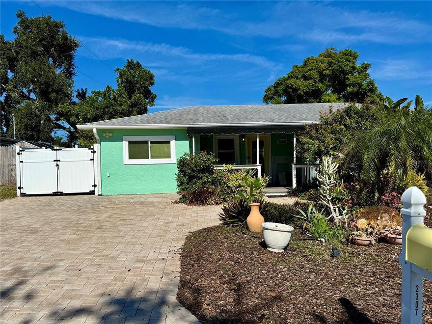 Welcome to this delightful 3-bedroom, 1-bath home located in the highly sought-after Bayshore Gardens community. Step inside to find a beautifully updated kitchen that seamlessly opens to the living room—perfect for entertaining family and friends. The spacious layout offers both comfort and functionality.

Outside, you’ll find a large shed plus an additional outbuilding ideal for extra storage or a workshop setup. Whether you're a hobbyist or just need more room, this space has you covered.

Living in Bayshore Gardens means access to an array of amenities including a Jr. Olympic-size swimming pool, expansive pool deck and patio, playground, picnic pavilions with BBQ grills, ball field, and a fishing pier complete with a cleaning station. Boating enthusiasts will love the private marina and boat ramp, and residents can also enjoy a recreation hall—all available at reduced rates.  A non-ad valorem annual fee of $417 is included in the property taxes for the Bayshore Gardens Park and Recreation Dist.

Don't miss the opportunity to own a home in this vibrant, amenity-rich community!