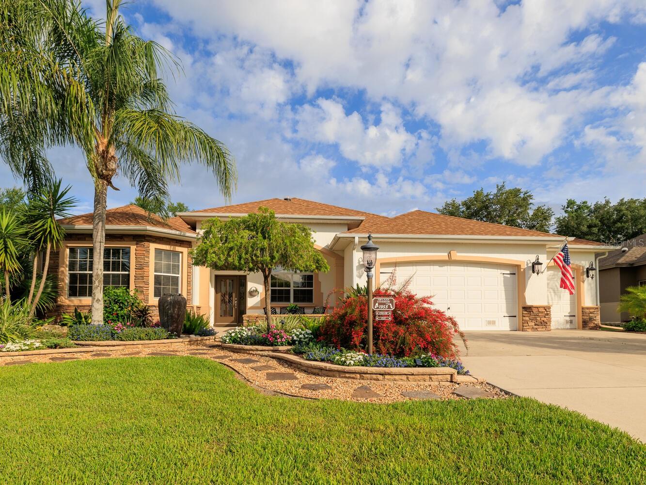 VILLAGE of BRIDGEPORT at LAKE MIONA offers PREMIER POOL HOME with the perfect balance of Luxury and a Comfortable lifestyle and no HOMES IN BACK!! You will see the pride of ownership in this Exceptional home. Check out the Gorgeous Kitchen with refreshing changes which include new Quartz countertops with matching Backsplash in the Kitchen to complete the finishing touch. We also have more updates with this design; freshly painted Cabinets in Kitchen and laundry room, new light fixtures, and new flooring, The bathrooms also received a little more attention. Please give notice to the Quartz countertop and new Glass shower doors in the guest bathroom and pool bathroom. Beautiful NEW Landscaping that enhances the STACKED STONE GARDEN BEDS, SWAYING PALMS, STONE FAÇADE, Landscape LIGHTING, and FRONT PATIO enhancing the Exquisite Curb Appeal. Enjoy this relaxing and PRIVATE setting as you unwind in your 23’ x 11’ SALTWATER SOLAR-HEATED POOL or HOT TUB as you enjoy the view of your newly landscaped backyard!
The Main living area opens to the 34’ x 22’ GLASS ENCLOSED LANAI which is equipped with a Mini-Split System for year-round comfort. This additional 748’ creates the perfect space for Entertaining family and friends. This spacious room also offers a built-in kitchen with sink, refrigerator, beverage refrigerator, plenty of cabinetry, and a large granite countertop.
With 3 bedrooms, 3 newly updated bathrooms, 2 Car Garage with GOLF CART Garage, BONUS/Office with a large walk-in closet, this WILLIAMSBURG PREMIER Home boastfully showcases this expanded home with Quality upgrades are evident throughout the home. The 10’ ceilings, crown molding, plantation shutters, cornices, and 5 solar tubes add to the overall elegance. The primary bedroom features two walk-in closets, his/hers sinks with newly installed over sized underneath lavatories with 8” center faucets, a Roman shower, and a JETTED SOAKING TUB for a spa-like experience. The additional Bonus room off the Primary Bedroom offers flexibility for use as an exercise space, craft room, office, or personal retreat, and offers an additional Walk-in Closet! Sliding barn doors provide privacy to the guest wing - the spacious front room has a set of bay windows, and the other is En-suite with a beautiful Guest Bath which can also be accessed from the hallway. Not only is there plenty of closet and storage space, but all closets in the home are customized for optimal storage. The OVERSIZED 2-car garage also has a Golf Cart Garage and check out the “Magic Stairs” as it provides easy access to the attic with a radiant barrier for energy efficiency. ROOF December 2023, A/C was replaced in 2015 and has 3 Zones, On-Demand Tankless water heater was installed in 2021. This home combines comfort, style, and functionality for the perfect Florida lifestyle. Prime location, just 1.5 miles from Lake Sumter Landing and across Buena Vista from Arnold Palmer's Championship Country Club, easy golf cart access to all of the amenities So you can start enjoying The Villages lifestyle on Day 1. The Bond is also Paid.