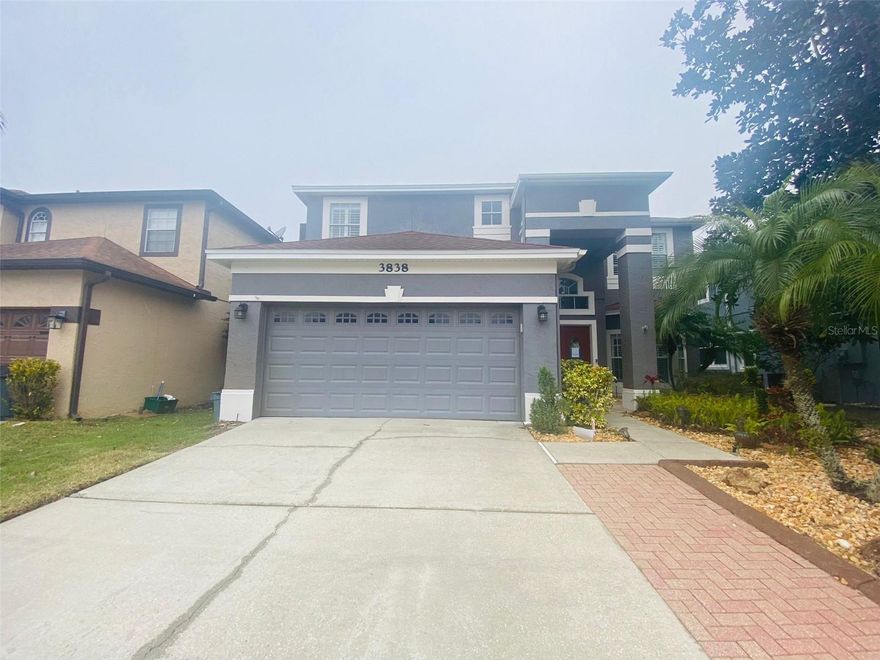 Discover this stunning 2-story, 4-bedroom, 2.5-bathroom masterpiece, tucked away in a family-friendly Oviedo neighborhood. Designed for modern living and effortless elegance, this home offers an unmatched blend of comfort, style, and functionality.

The warm and inviting living spaces set the tone for this exceptional home. A cobblestone fireplace in the living room provides the perfect centerpiece for cozy gatherings, while the electric fireplace in the master bathroom adds a unique touch of luxury and relaxation. Every detail has been thoughtfully curated, including a charming mint powder room with a ceramic sink that exudes character and sophistication.

The gourmet kitchen is fully equipped with modern appliances and seamlessly flows into a delightful breakfast nook, creating an ideal setting for casual family meals or intimate mornings. Upstairs, the lavish master suite offers a true retreat with its spa-like bathroom, complete with a soaking tub, a walk-in shower, and a built-in master closet that combines elegance and functionality.

This home boasts gleaming light floors throughout the first floor, lending a sleek and contemporary vibe, while rich wood flooring on the second floor adds warmth and timeless charm. Outside, you’ll find an entertainer’s dream with a beautifully designed garden featuring pergola beam décor and a spacious patio, perfect for hosting gatherings or enjoying serene evenings under the stars.

Practical conveniences like a dedicated laundry room and a garage are also thoughtfully included to enhance your everyday lifestyle. Situated in a welcoming neighborhood, this home offers the perfect balance of community, comfort, and nearby amenities that cater to families.