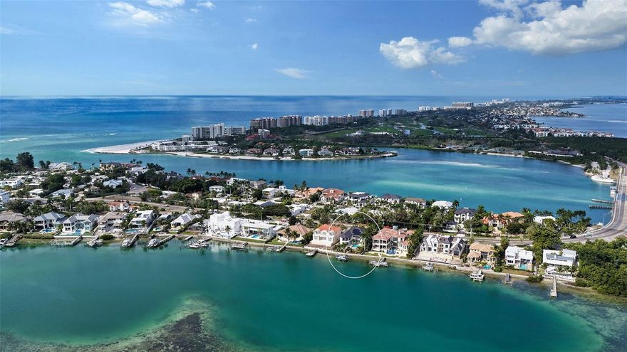 Discover refined living and tranquility in this stunning home set within the esteemed Lido Shores neighborhood. Step inside through striking Sapele entry doors into a thoughtfully remodeled residence by award-winning designer Mindy Webb of Mindy Webb Design. The instant you enter, you're greeted by a breathtaking wall of windows that highlights the infinity pool, sweeping views of Sarasota Bay, the city skyline, and the impressive John Ringling Bridge.
Inside, a contemporary color palette and premium finishes elevate every room. The spacious five-bedroom estate reveals meticulous craftsmanship throughout, with Italian flooring, a gourmet chef’s kitchen, butler’s pantry, billiard room, two wet bars, a climate-controlled wine cellar holding up to 648 bottles, intricate crown molding, tray ceilings, an office/den, and a two-stop elevator. The master suite on the main floor includes dual custom walk-in closets and a spa-like bathroom, while an extraordinary collection of chandeliers adds a touch of elegance. Three of the additional en suite bedrooms provide comfort for guests or family, and the show-stopping wine cellar will delight any enthusiast.
Start your mornings peacefully, taking in sunrise hues over the bay, watching dolphins and manatees glide by, or relax at night beside a fire on the upper balcony, enjoying views of the glowing Ringling Bridge and Sarasota skyline. Outdoor features include a summer kitchen, two separate dining spaces, a 16,000 lb boat lift, two Jet Ski lifts, a Kayak/Paddle Boat platform (9' x 14') with rack, and an additional 16' x 9' platform.
Sustainable updates abound, like 51 new solar panels paired with three Tesla storage batteries. End your day with a stroll along your private beach. This home has been expertly renovated and meticulously maintained—simply bring your suitcase and move right in! Additional upgrades include a new four-zone Trane air system (2018) and full fencing with gate access.
BONUS: A brand-new roof was installed in 2025. NOTE:  Furniture can be purchased on a separate contract.