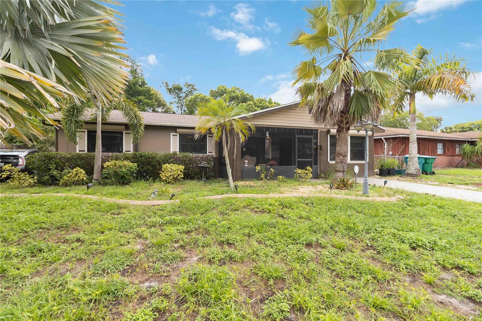 This 4-bedroom, 2-bath home offers 1,983 sq. ft. of living space with an open layout connecting the family room, dining, and kitchen areas. The kitchen features a skylight and a peninsula that opens seamlessly to the family room, while a Florida room connects directly from the kitchen and leads out to the backyard deck with a 12x12 hardtop gazebo that conveys. Both bathrooms also have skylights, with the primary suite offering dual sinks, a large walk-in shower with opposing shower heads, and a spacious storage area. Additional highlights include a screened-in front porch, smart door lock and handle, and a 3rd Gen Google Nest thermostat. Major updates include a new roof with foam insulation throughout the attic, outdoor HVAC and indoor air handling units, outdoor circuit breaker box, double-pane windows, roll-down hurricane shutters, and a sprinkler system. The home is also equipped with a whole-home water filtration system and a reverse osmosis system above the refrigerator, both of which convey. While a refrigerator will be included, the LG refrigerator currently in the kitchen does not convey. The home is wired for modern living with Fiber Optic internet up to 5GB, Cat8 ethernet connections throughout, and a security system with cameras (doorbell excluded). Conveniently located near restaurants, shopping, nature preserves, and major highways, with Downtown Orlando just a short drive away, this home is move-in ready and waiting for its next owner.
