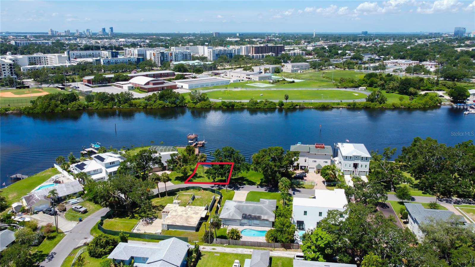 This is the perfect opportunity to own prime property in the Ridgewood Park district of Tampa. This property sits on the Hillsborough River which would give a homeowner or a developer a canvas to build a custom home or potentially a multifamily development. There are three contiguous properties, this one included that are available for sale by the same owners. All properties together would provide an investor or developer the chance to seize an opportunity to develop on a significant stretch of riverfront land that offers build ability and zoning potential. This property is very central to everything Tampa has to offer such as eateries, schools, Armature Works and just a quick travel to the downtown area.