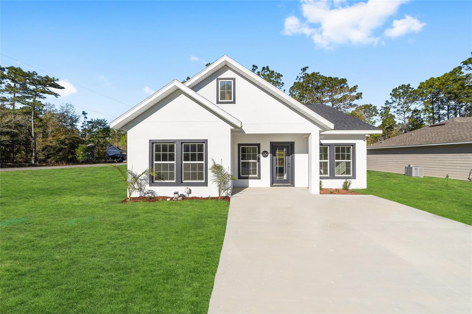 BRAND NEW 2025 Custom Built Grayson Model Home AVAILABLE FOR LEASE! Nestled in the up-and-coming Williston Highlands Golf and Country Club, it offers the perfect balance of modern farmhouse, luxury and comfort! This stunning custom built 2 bedroom, 2 bathroom, plus office home offers the perfect blend of modern design and comfortable living. This spacious, open concept floor plan offers ample natural light throughout the home, modern fixtures and fine finishes, including a beautiful fireplace and many upgrades! Featuring a beautiful split floorplan with luxury vinyl flooring throughout, no carpet! The heart of the home boasts a combination kitchen/dining room with a raised island for guest seating. The chef's kitchen features quartz countertops, top-of-the-line appliances, upgraded cabinetry with soft-close hinges and ample counter space. Kitchen and Dining area seamlessly flows into the great room, making it perfect for entertaining. The great room features a custom built-in entertainment piece featuring a modern electric fireplace! The master en-suite is a true retreat, featuring a curb less walk-in tile shower (and glass enclosure) and dual vanities, premium luxury tile and quartz countertops. The second bedroom features large windows a spacious walk-in closet and full guest bathroom that are just down the hall, providing a perfect amount of separation for privacy. This home features a full office in addition to the bedrooms, with privacy doors and large windows overlooking the beautiful backyard with doors leading out to the lanai! Enjoy evenings on the covered back porch, and let your imagination run wild with the possibilities for your large yard. This home includes features and finishes hand-selected by our professional designers to provide you with enduring style, move-in convenience, and easy home maintenance! This energy-efficient home boasts premium finishes throughout, such as, luxurious low-maintenance waterproof vinyl plank flooring throughout, Energy-efficient LED lighting, Double-pane Low-E windows, Fully sodded homesite, Quartz countertops, Soft close cabinetry, Custom backsplash, Remote controlled ceiling fans, High end appliances and finishes package and more! Prime Location!! 15 minutes to HITS and just 20 minutes to Gainesville and 30 minutes to Ocala and The World Equestrian Center! You’ll enjoy the best of both worlds—small-town charm with easy access to city amenities. Plus, adventure is right outside your door with nearby attractions like Devil’s Den Prehistoric Spring, Blue Grotto Dive Resort, Cedar Lakes Woods & Gardens, and the Goethe State Forest. Schedule your tour today!