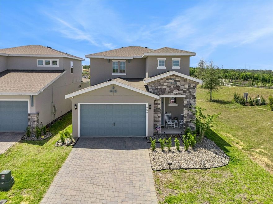 Highly Upgraded Magnolia Floorplan | Near Community Amenities | Move-In Ready |

One of the closest homes to the Hills of Minneola recreation center, this Magnolia floorplan offers convenient access to community amenities within an active new construction neighborhood. Built by Dream Finders Homes, the Elevation C exterior with stone detailing enhances curb appeal, complemented by a paver driveway and covered entry.

This property presents a completely upgraded, move-in ready option within the community. Buyers can avoid the build timeline, incremental upgrade costs, and multiple design decisions associated with purchasing through the builder.

Interior features include 8’ doors throughout, an open stair railing, and upgraded flooring across the main living areas and loft. The kitchen is finished with quartz countertops, a farmhouse sink, upgraded cabinetry with glass accents, tile backsplash, and enhanced hardware. Bathrooms include upgraded tilework, quartz surfaces, and extended shower finishes.

The Hills of Minneola community includes a clubhouse, pool, and recreational amenities, with ongoing development contributing to the area’s growth. Additional improvements such as window blinds, added lighting, structured wiring, a finished garage floor, and custom closet systems make this a complete move in ready home.