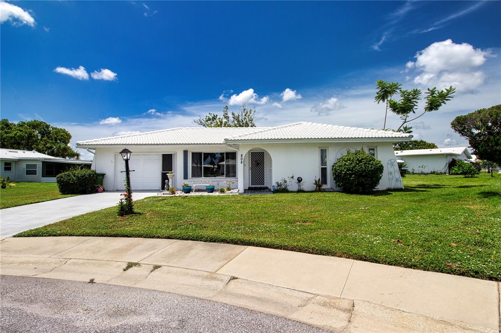 Welcome to your new home, located on a quiet cul-de-sac in River Isles, a highly desirable 55+ golf course community
situated on the Braden River, with many other amenities for you! This home features a **newer roof 2024 **, 2 bedrooms, 2 bathrooms, offering over 1400 sq.ft of living space. Enjoy the cozy Florida room with a picture window overlooking shade tree with garden sunset views. The primary bedroom is spacious, a generous walk-in closet, freshly painted, new LVP flooring, the renovated ensuite bathroom offers a tiled shower and multifunctional shower head panel. The guest bedroom with a walk-in closet, new LVP flooring, offers plenty of room for guests. The renovated bathroom with a deep soaking tub adjacent to the guest bedroom hallway. Prepare your favorite meals in the updated kitchen, equipped with modern Bosch and LG appliances, including a slide-in convection stove, deep granite composite sink, touch less faucet, solid Cambria marbled quartz countertops, bright stone backsplash, updated kitchen cabinets. Step out to the screened-in lana with see-through privacy shades, which includes the back patio with landscaped garden view and shade tree. Updates include a New roof (June 2024), upgraded kitchen, bathrooms, windows, updated lighting, LVP flooring, new baseboards throughout, painted home exterior, invisible pet-friendly fence, sprinkler system, ensuring years of enjoyment without the need for renovations. River Isles is an active social community with low HOA fees. Enjoy the temperature-controlled pool for year-round swimming or the well-equipped fitness room in the clubhouse, which many residents love. Additional amenities include a pool table, ping-pong table, and a library for your entertainment. Social activities abound, including a weekly shuffleboard group, Friday bingo, Wednesday aerobics, card games, pancake breakfasts, and the opportunity to meet new friends and neighbors while embracing the River Isles lifestyle. River Isles Golf Club is a favorite spot for the golf enthusiasts - with a 9-hole executive golf course and an option to join a yearly membership with unlimited golf, making it an accessible and affordable option. Visit Coquina Beach on Anna Maria Island, just minutes away. Put your toes in the sand. Additionally, the home is conveniently located near airports, the interstate, restaurants, medical facilities, two major hospitals, and UTC Shopping Mall.