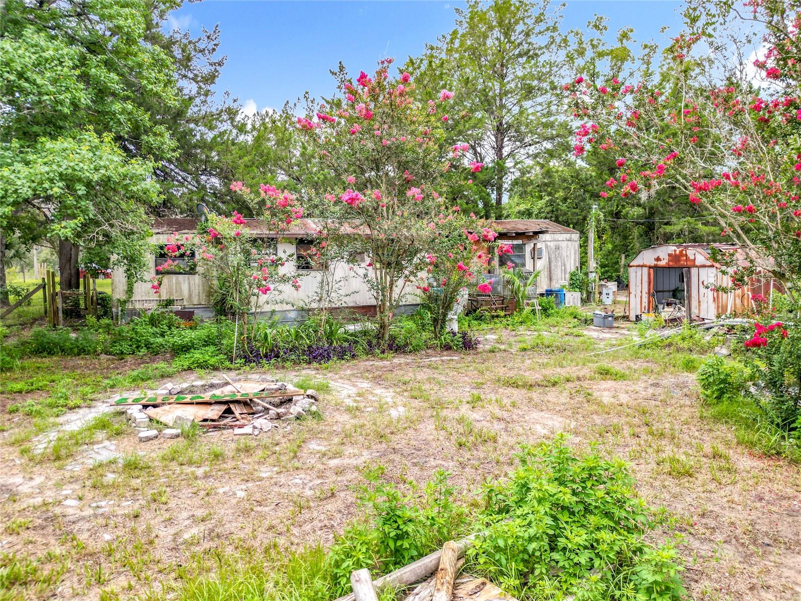 Existing single-wide mobile home on property conveys at no value; listing is priced for land only. Approx. 0.46 acres with partial fencing and two driveways. Utilities (well, septic, electric) believed present—buyer to verify. Zoned CLR MH. No HOA or deed restrictions. Area supports manufactured homes. Ideal for removal, replacement, or land hold. Property is accessible but do not enter without appointment. Cash or private financing only due to condition. Buyer responsible for all due diligence and inspections.