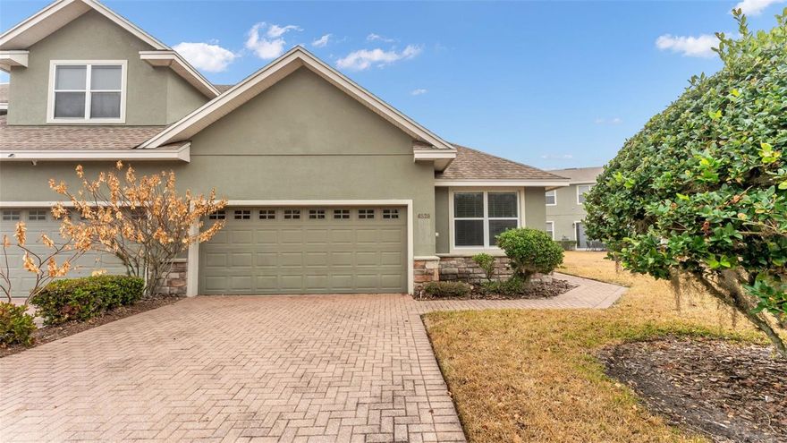 One or more photo(s) has been virtually staged. Welcome to this beautifully maintained 2 bedroom, 2 bathroom townhome located in the gated community of Chelsea Oaks. This move-in ready home offers an inviting open floor plan and luxury vinyl plank flooring throughout, with the exception of the guest bedroom. The kitchen features granite countertops, stainless steel appliances, and ample cabinetry, making it both functional and stylish. The primary bedroom provides a comfortable retreat with an ensuite bathroom complete with dual sinks, a garden tub, a tiled walk-in shower, and a spacious walk-in closet. The second bedroom is thoughtfully positioned on the opposite side of the home near the laundry room and second full bathroom, offering privacy and convenience for guests or family members. Residents of Chelsea Oaks enjoy access to a community pool and fitness center, adding to the appeal of this low-maintenance lifestyle. Ideally located near major retailers, restaurants, and offering easy access to I-4, this home provides both comfort and convenience. Call today to schedule your private tour