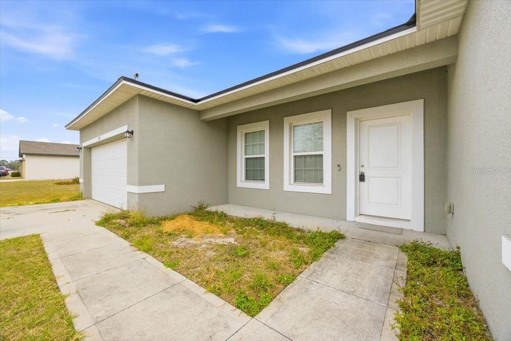 Photo of 213 Cimarron Dr, Poinciana, FL 34759 (MLS # O6386692)