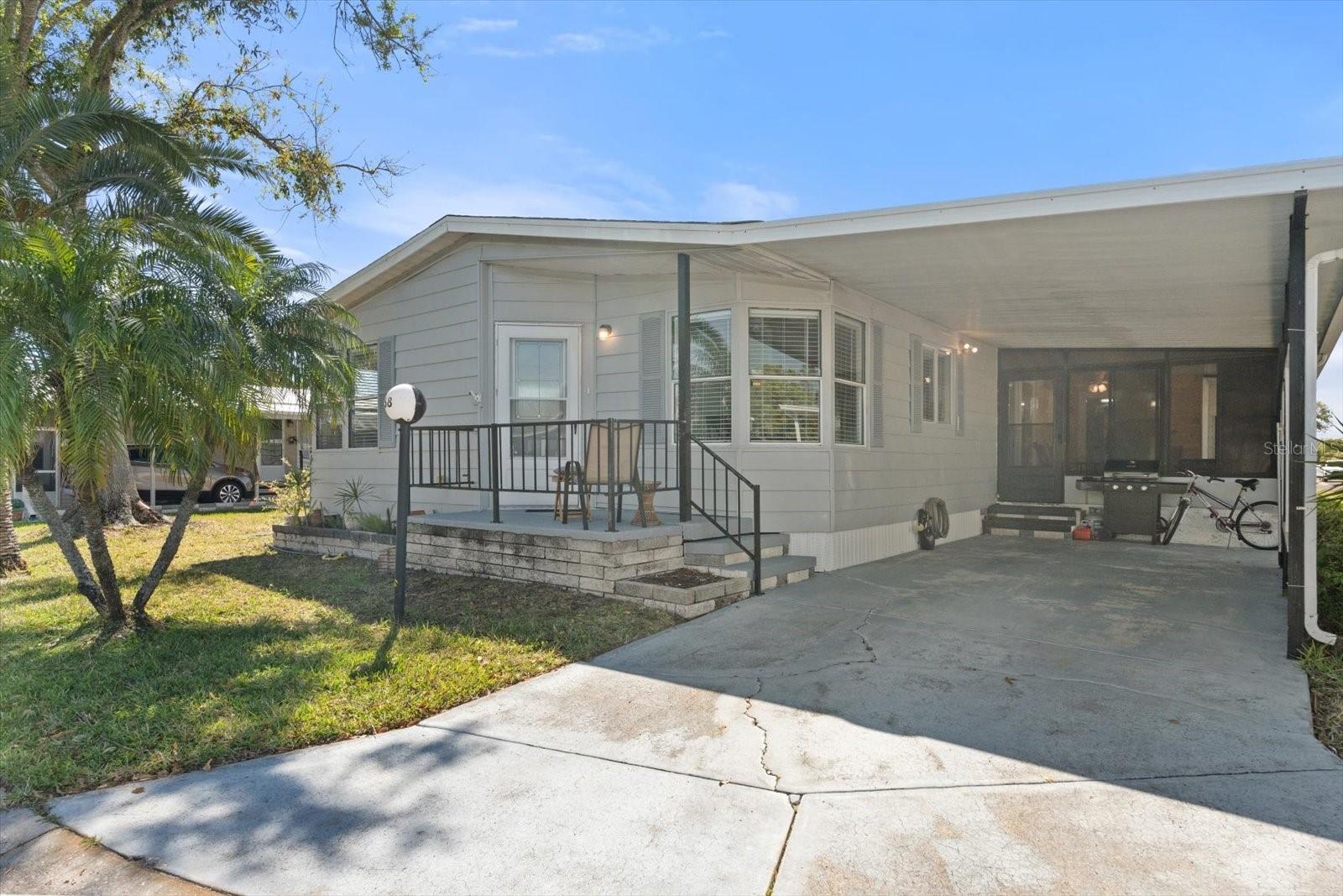 2 bedroom 2 bath turnkey furnished home located in Gold Tree co-op park. A beautiful, friendly, well maintained gated 55 + community just off Lockwood Ridge Rd and State Rd 70. This home offers a traditional layout with an open floor plan with living/dining room combination, eating area in kitchen and a small bar area between dining room and kitchen. Enclosed Sunroom/ lanai with separate laundry room and storage area. There are many updates throughout, a must see!! Located near shopping, UTC mall, the srq airport, Gulf Beaches & I-75 for easy commuting. Very Active community with tennis and pickleball courts, shuffleboard, bounce ball, Library and fitness area. Large community heated pool and hot tub with tranquil pond view