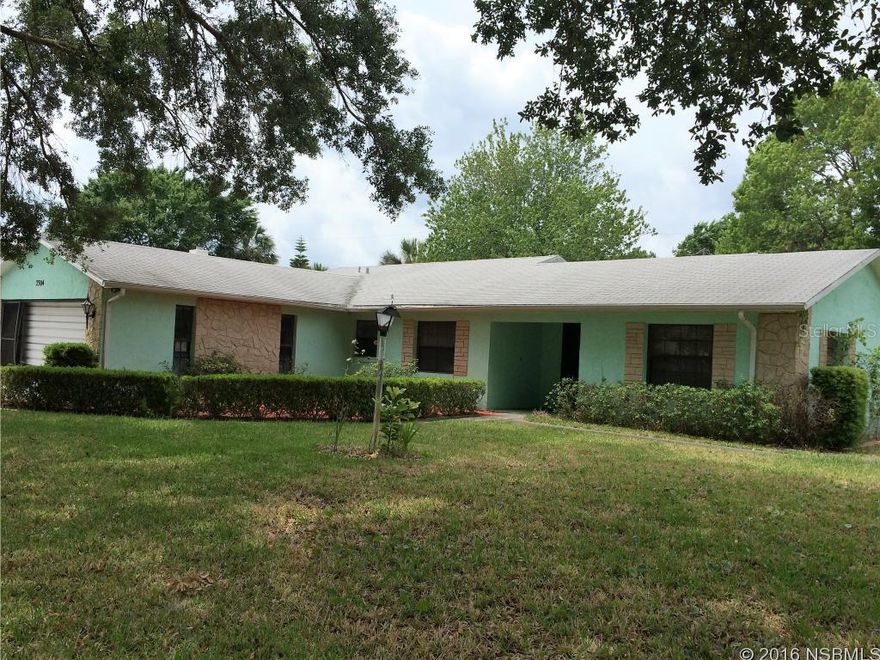 Great house on a triple lot, split plan, with both bedrooms have private access to the bathrooms, Kitchen with oak cabinets, Breakfast nook, Big family room and second living space to be a formal dining room, sliders off the family room lead to a florida room, shed in rear yard, inside utility room, oversized garage, some fruit trees, block construction, nicely landscaped. could be a three bedroom, new hvac system, newer water heater, paved walkways around the house. ;Water: City