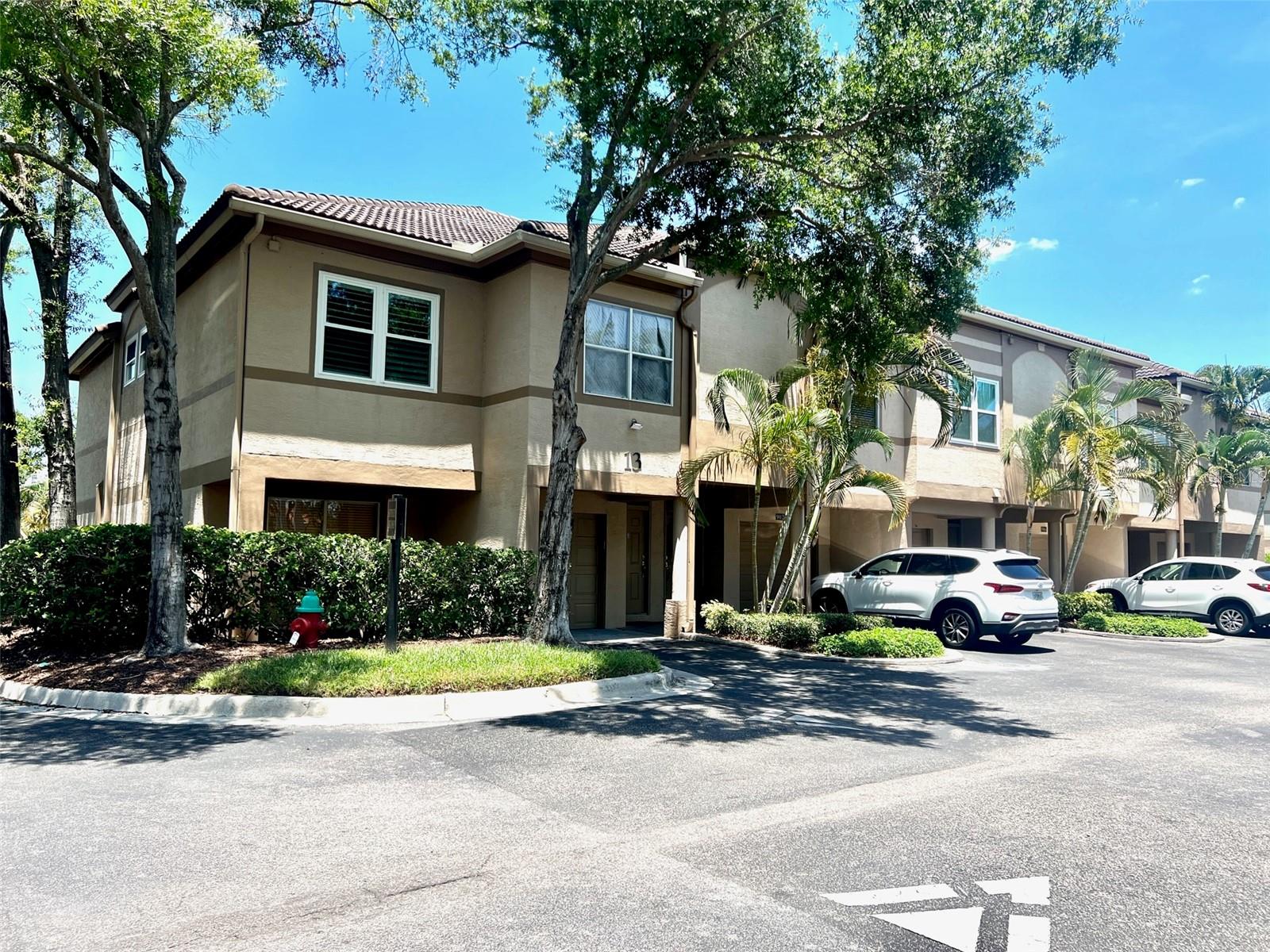 Welcome to Island Walk on the exciting, beautiful Harbour Island. This 24/7 gated community is within walking distance to Amalie Arena, Sparkman Wharf, Water Street, Tampa Riverwalk, Channelside, and plenty of 5-star restaurants. This fabulous renovated 2 Bedroom, 2 Bathroom, 1 Car Garage is an end unit with extra windows allowing plenty of natural light into the home. This corner unit offers an open floor plan, elegant engineered wood floors, custom-made white cabinets, a pantry, exotic granite counters, stainless steel appliances, custom bronze rails finished in powder coating, a covered balcony, and 4-inch white shutters in bedrooms and bathrooms. These split-plan bedrooms are spacious, with walk-in closets and en suite bathroom with walk-in shower and window. New 6 (six) hurricane and high impact windows were installed in 2023, an $11,000 upgrade & A/C unit was replaced in 2018 with a WiFi Nest thermostat, W/D in the garage. Guest parking is conveniently located in front of the building. Resort-style amenities include two tennis courts, a pool, a hot tub, a fitness center, a clubhouse, a playground for children, and a BBQ area, with water access for kayaks and paddle-board; the community has an on-site manager with maintenance staff. Harbour Island has continuously been voted one of the "Best Places to Live in Florida."
