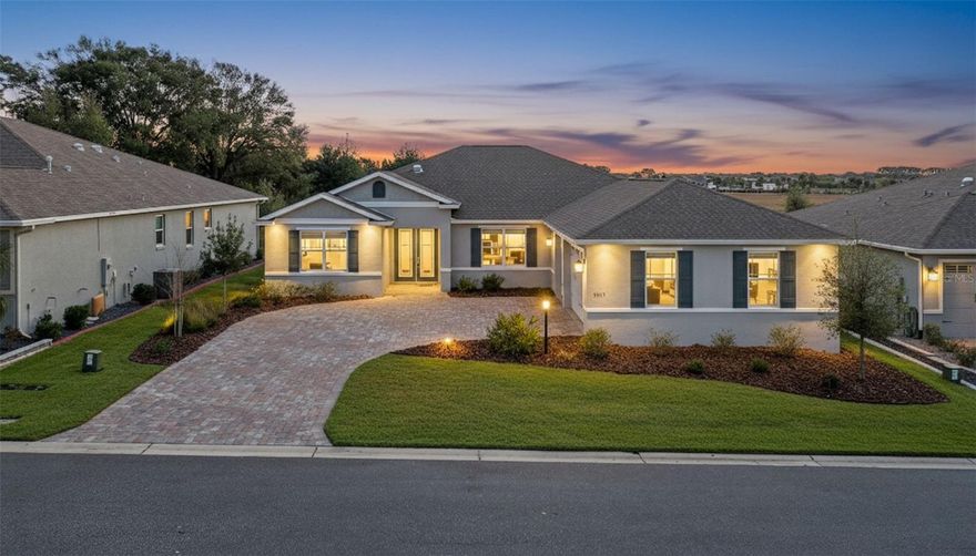 Step into luxury in this stunning single-family home located in the gated On Top of the World Candler Hills community in Ocala, Florida. Boasting 3 bedrooms, a versatile office, 2 bathrooms, and 2,969 square feet of elegant living space, this home offers both comfort and style. Upon arrival, you’ll be captivated by the spacious driveway leading to a 3-car side-facing garage. French doors open to reveal an open-concept floor plan connecting the living room, kitchen, and dining area seamlessly. The living room impresses with tray ceilings and a striking stone wall featuring a built-in electric fireplace. Adjacent, the enclosed Florida room is drenched in natural light, creating the perfect spot to relax or entertain. The kitchen is a showstopper, featuring a waterfall island with breakfast bar, a dry bar with wine storage, and top-of-the-line stainless steel appliances paired with a striking stone backsplash. The dining room flows effortlessly from the kitchen, ideal for gatherings large or small. The split bedroom layout ensures privacy, with a primary suite featuring tray ceilings, two walk-in closets, and an en suite bath with dual sinks and a walk-in shower. The additional office offers flexibility as a fourth bedroom, game room, or workspace. Step outside to a private porch overlooking serene surroundings with no rear neighbors. On Top of the World provides an exceptional lifestyle with multiple pools, social rooms, a fitness center, and endless amenities. Conveniently located near golf courses, dining, shopping, grocery stores, and with easy access to I-75, this home delivers both luxury and accessibility. Mortgage savings may be available for buyers of this listing.