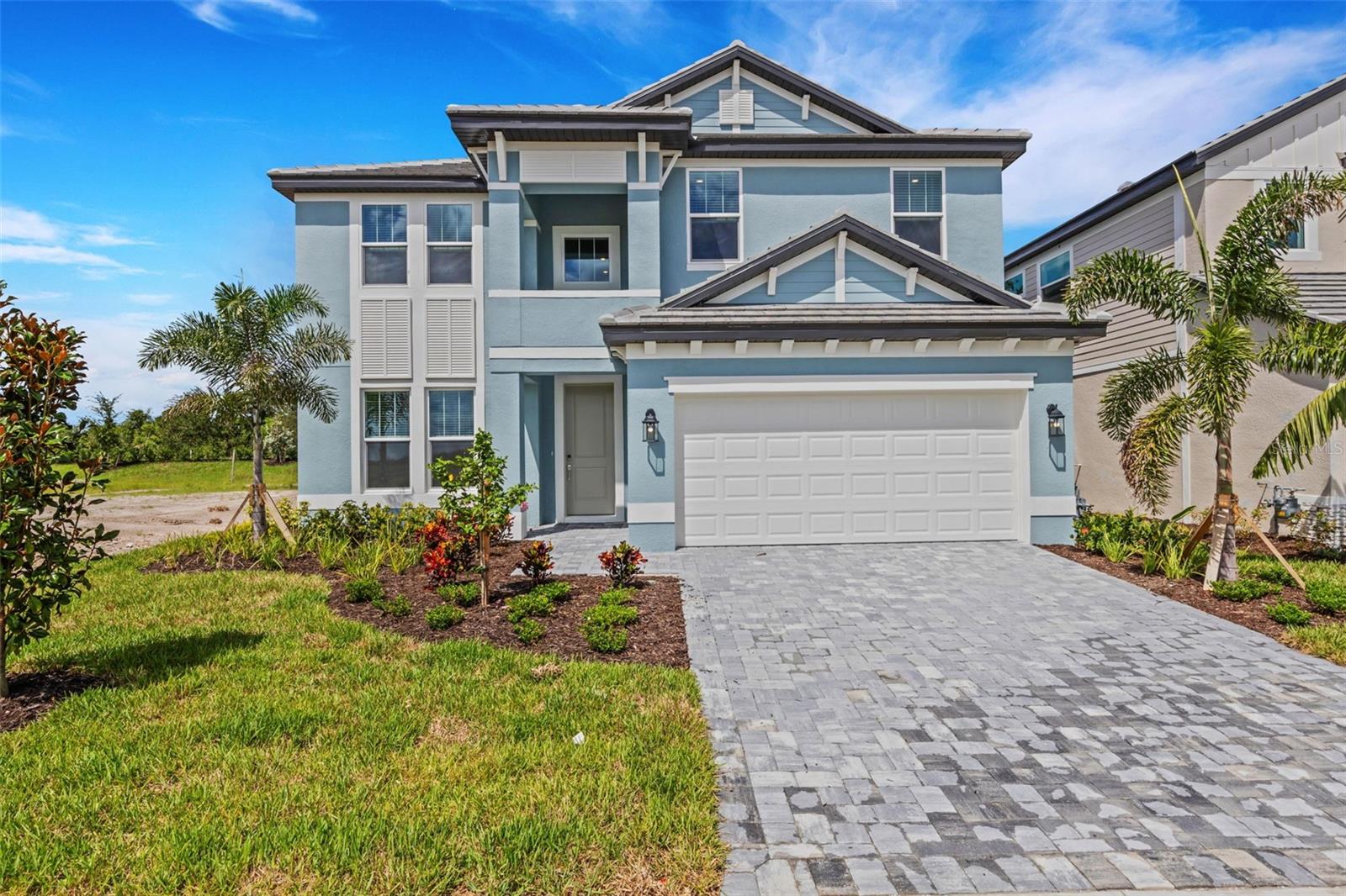 Welcome to Hawkstone! We’re excited to announce that Hawkstone is now open! This stunning 5-bedroom, 4-bath home features an open, light-filled floor plan designed with both family living and entertaining in mind. With zero wasted space and today’s most sought-after modern features, every detail has been thoughtfully crafted. The mature landscaping and majestic grand oak tree in the backyard create a private retreat, offering shade, serenity, and timeless beauty. Hurricane-impact windows provide year-round peace of mind—protecting against storms while reducing noise, boosting energy efficiency, and even helping lower insurance costs. The lanai is already plumbed and ready for a custom outdoor kitchen, giving you the opportunity to design the ultimate gathering spot for grilling and enjoying the Florida lifestyle. Nestled just off State Road 72 and five minutes from I-75, Hawkstone offers the perfect balance of serenity and convenience, with easy access to Downtown Sarasota, Lakewood Ranch, and Florida’s world-famous Gulf Coast beaches. With no CDD fees, natural gas, and a selection of 52’ and 62’ floor plans, this boutique community of only 155 homesites delivers unmatched value. Every home includes a 10-Year Transferable Structural Warranty, one year of dedicated Customer Care, and manufacturer warranties on key components and appliances—giving you complete confidence in your investment. Come experience why Hawkstone is one of Sarasota’s most exciting new communities!