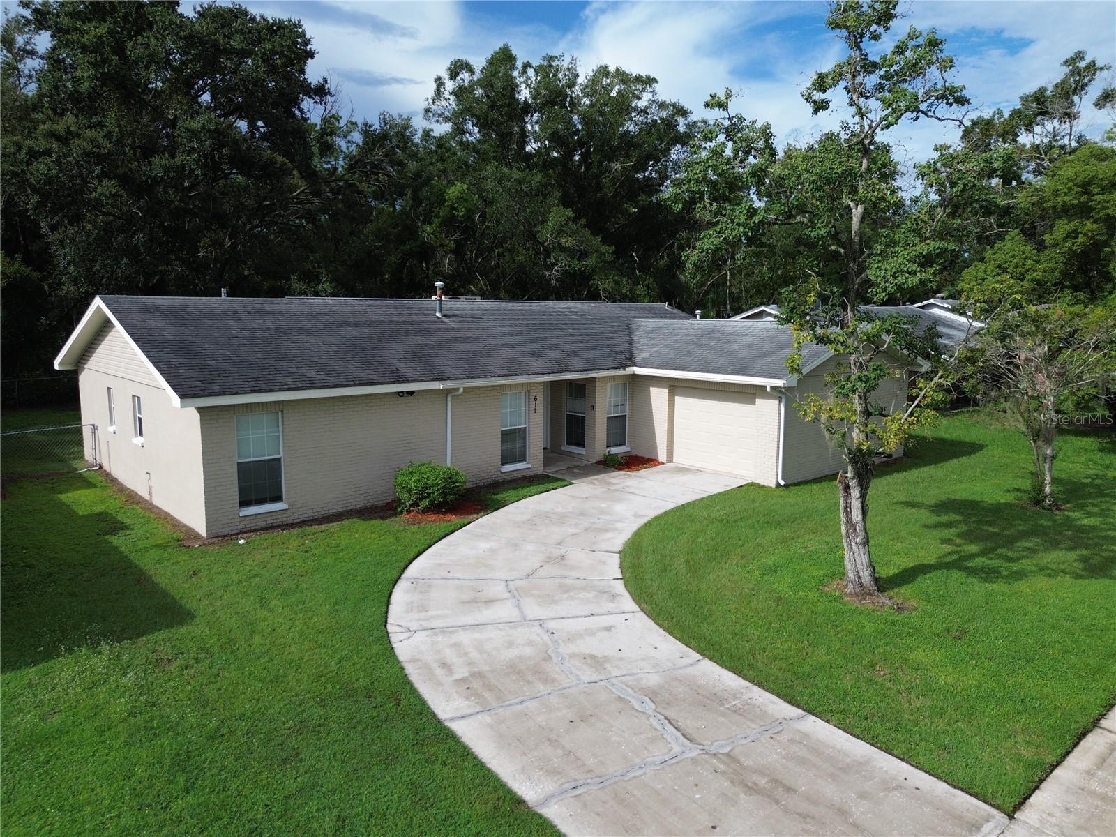 Welcome to your new home at this 1,528 sq. ft., 3-bedroom, 2-bathroom gem nestled in the serene Southwood Hills neighborhood. Priced to sell, this home offers a fantastic opportunity to create your dream space with no HOA or CDD fees! The home was fully re-piped with durable PVC in 2019, replacing copper for peace of mind. The AC system, with a new coil and compressor (2019), keeps you cool, while a natural gas furnace ensures year-round comfort. Energy-Efficient Windows! Tempered, insulated windows (installed 2008) on the front and sides enhance energy savings and durability. Spacious & Versatile Layout: Step into a large flex space perfect for a dining room, 4th bedroom, den, or even a second office space. The living room boasts a stylish fireplace and sliding glass doors opening to a covered porch and generous backyard, ideal for relaxation or entertaining. The kitchen overlooks the living room and features a gas stove and granite counter tops! The primary bedroom offers a walk-in closet, en-suite bathroom with a sleek glass shower stall and single vanity with sliders leading to the screened lanai. Two additional bedrooms, comparable in size, face the front of the home for a quiet retreat. Location! Minutes from Brandon Mall, shops, and restaurants, with easy access to I-75, Crosstown Expressway, downtown Tampa, MacDill AFB, and Tampa International Airport. Enjoy the perfect balance of suburban tranquility and urban convenience. Priced to sell, this Southwood Hills treasure is ready for your vision to make it home. Schedule a showing today and seize this incredible opportunity!