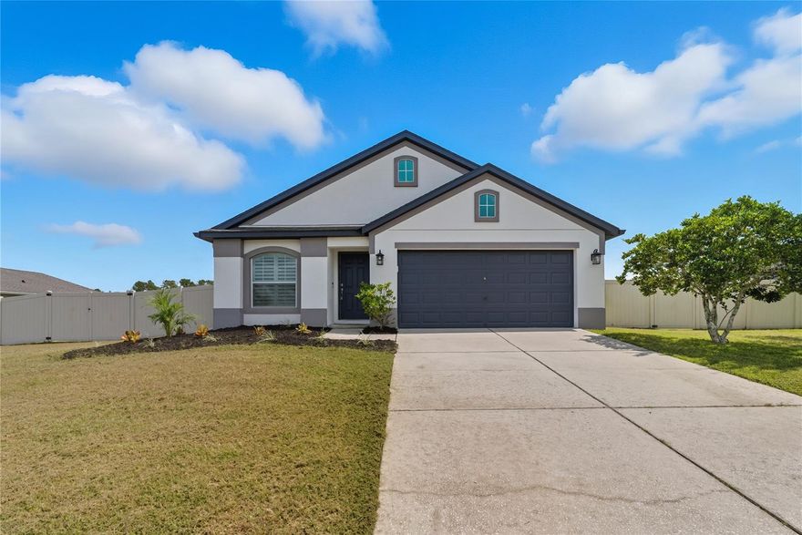 Welcome to 12410 Loopback Drive. This Inland Homes Rosewood model offers 3 bedrooms, 2 baths, and a versatile den/office—beautifully maintained by its original owner with thoughtful updates throughout. Step inside to vaulted ceilings and custom plantation shutters that create an open, inviting feel. The kitchen is the heart of the home with granite counters, a raised bar top, and a custom extended coffee bar with extra storage—a feature unique to this Rosewood model. The primary suite provides a private retreat with dual vanities, a soaking tub, and a separate shower. Two additional bedrooms plus the den/office provide flexibility for guests, work, or hobbies. The sunroom addition expands the living space, while the fully fenced backyard delivers privacy and plenty of options—with room for a pool, boat storage, and/or an outbuilding such as a shed or in-law suite (per HOA/city guidelines). Recent updates per seller include exterior paint (2023), water heater replacement with 10-year warranty (2022), septic system service with new leech field (2023), and lift station pump replacement (2024). A Tesla Level 2 charger will convey and landscaping service is already paid through the end of the year. Built with durability in mind, this home includes hurricane strapping, poured lintels, radiant attic sheathing, and an in-wall termite treatment system with a 20-year builder-applied warranty (per seller; buyer to confirm transferability). Located in the charming town of San Antonio with its local shops, dining, and community feel, this home also offers quick access to I-75, Publix, the Mirada Lagoon, and all that nearby towns like Dade City and Wesley Chapel have to offer.