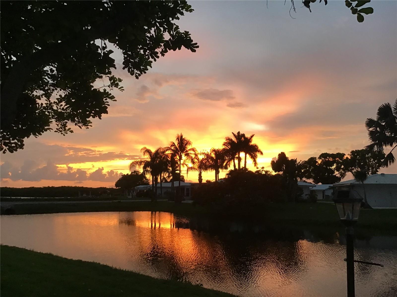 Imagine enjoying sunset after sunset overlooking the river and pond from your Florida room sitting on quality rattan furniture left for you. This location doesn’t get much better unless you factor in a spacious lot at the end of a quiet cul-de-sac in this premier 55+ golf community of River Isles.You are one block away from the clubhouse and amenities. The main feature of this home is the Florida room view, complete with 16” tile flooring to match the common area flooring, thermal glass slider windows, door sliders from kitchen, dining and master bedroom. Other than garage, all interior rooms, including Florida room, are under air. The kitchen has been upgraded with soft close cabinets and drawers, slider shelves, quarts counter tops, LED lighting and appliances, etc. The master bath has also been totally upgraded. The garage door motor+, water heater, A/C and ducts, roof over FL room, circuit breaker, and clothes dryer replaced. The master Suite includes a walk in closet with the guest room having a long in wall closet and storage area. With the quality of this home, coupled with the location and low HOA and golf fees, it’s hard to beat. You are located minutes from shopping, dining, medical, worship, airport, many cultural amenities and the beautiful Gulf of Mexico which is 13 miles away with beaches on Anna Maria Island, Bradenton
