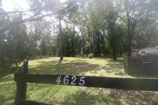 Peaceful Country Living on 2.6 Acres – Bring Your Animals, Toys & Big Dreams! Welcome home to this spacious 3 bedroom, 2 bath mobile home nestled on a fenced 2.6-acre lot in one of St. Johns County’s most serene and rural settings. This is more than just a property – it’s a lifestyle. Home offers split bedroom floor plan for added privacy, Large open living room with a cozy wood-burning fireplace – perfect for cool evenings. A Formal dining room plus a huge kitchen with island – entertain or cook up Sunday dinner with ease. Back porch and front deck for morning coffee or sunset unwinding along with Multiple storage sheds – ideal for tools, toys, or hobby space. Great acreage – bring your pets, plant a garden, or start a small farm. If you’ve been searching for space to breathe, land to roam, and room to grow, this property checks all the boxes. No HOA, no restrictions – St. Johns County, FL – Escape the hustle, embrace the quiet.